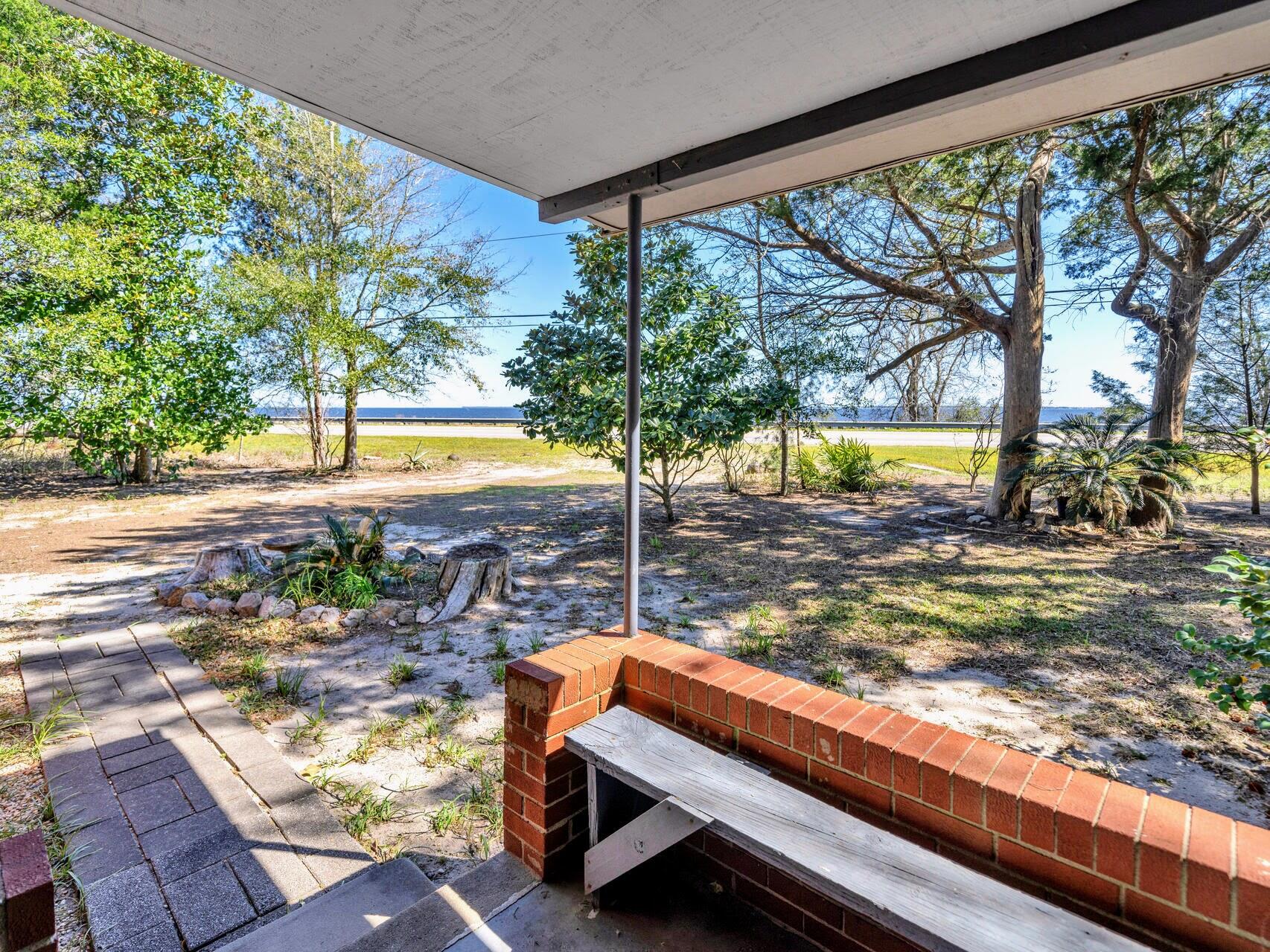 DON'T MISS THIS UNIQUE OPPORTUNITY featuring a 276' waterfront on the Choctawhatchee Bay PLUS an adjacent 1.2-acre corner lot with a cozy 3 Bedroom, two bathroom cottage. Choctaw Beach, Florida, while enjoying a Freeport mailing address, is in Walton County with lower taxes and a peaceful lifestyle. This property offers stunning bay views, outdoor & recreational activities, and easy access to nearby beaches and amenities. Build a dock on your waterfront or, simply enjoy the view. Available for the first time in 30 years, this is your opportunity to own this high and dry property where you can enjoy nature and relax in a picturesque setting with your own waterfront access! The cottage provides a comfortable living space while you build your dream home. Features include a screened porch perfect for enjoying the outdoors! Whether you are gardening, birdwatching, fishing, or simply relaxing this is your place! The view across the Choctawhatchee Bay includes the Sandestin and Miramar Beach skyline. Enjoy a great view of fireworks from 30A to Destin during summers and holidays. Easy access to the beach, Mid Bay Bridge, Destin Commons, Niceville, Destin, Freeport, Miramar Beach, and Santa Rosa Beach, Florida makes this a highly desired property. Convenient to airports, military bases, shopping, dining, entertainment, healthcare, and services this is a most sought after area - come to see for yourself why this property is your jewel along the Choctawhatchee Bay! Private Tours Available.