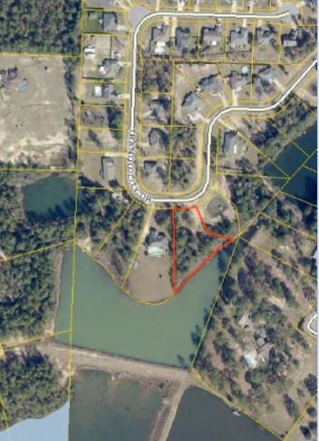 Beautiful Waterfront Home Site! With over 290 ft on the lake and a total .84 acre footprint your dream home would be perfectly placed on this picturesque lot! The street name says it all... Nothing but peace and tranquility to be experienced on beautiful Tranquility Drive! Take advantage of the low county taxes and the convenient location. Lot is wooded, preserve as much privacy as you desire. Imagine fishing from your own back yard. Priced to sell!