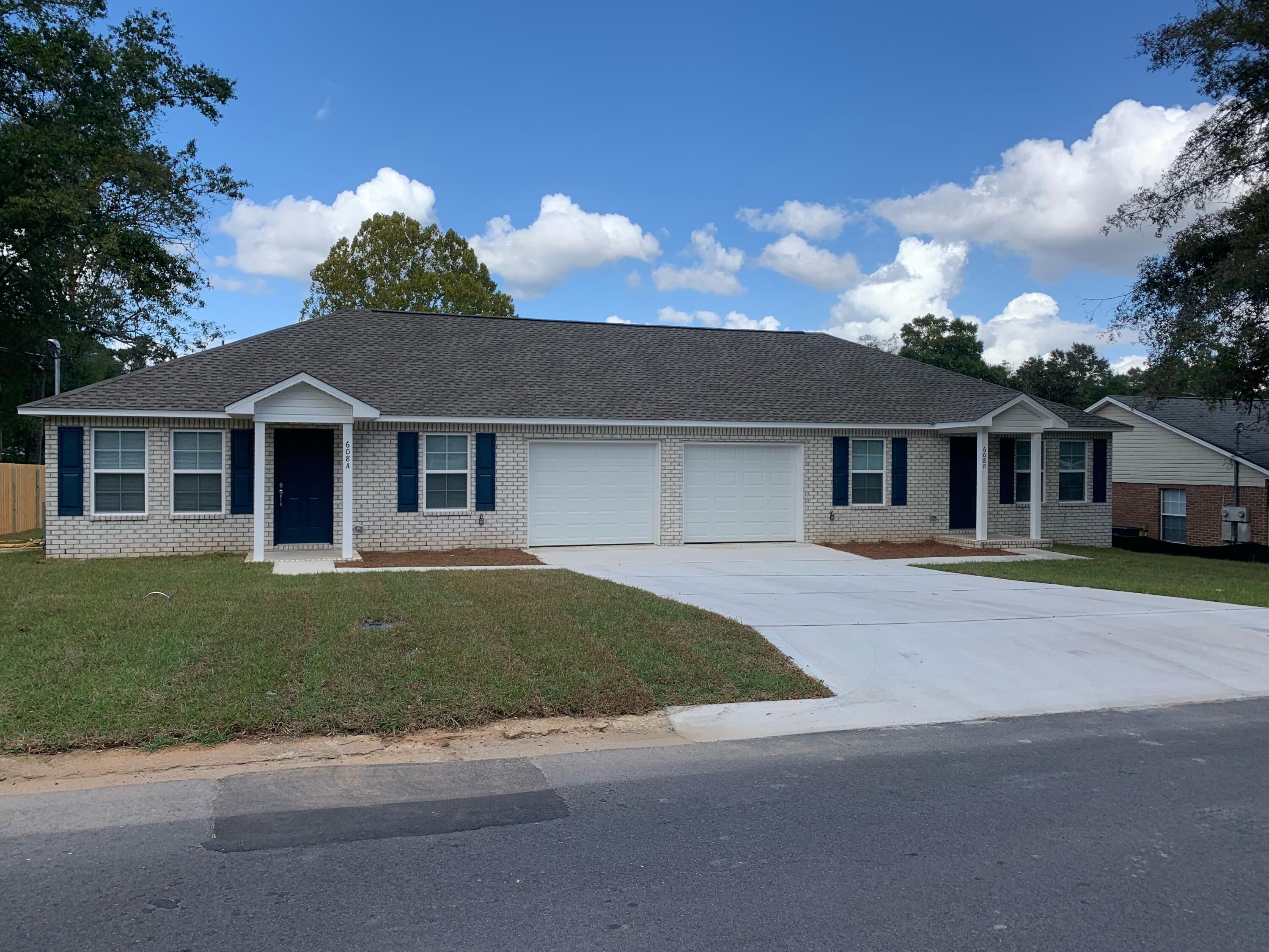 Now available for rent--this newly constructed 2 bedroom, 2 bathroom duplex is located in the heart of Crestview, Florida. Nestled in an established neighborhood undergoing exciting revitalization, this modern duplex offers style, functionality, and convenience. Inside, you'll find an open-concept layout with luxury vinyl plank flooring throughout. The kitchen features granite countertops, stainless steel appliances, and timeless shaker-style cabinets. Both bathrooms are finished with elegant marble countertops. Laundry hookups are included--just bring your own washer and dryer for easy, onsite laundry. Enjoy the privacy of a fenced-in backyard with fresh sod and a small patio, ideal for relaxing or entertaining. A single-car garage adds extra storage and convenience.