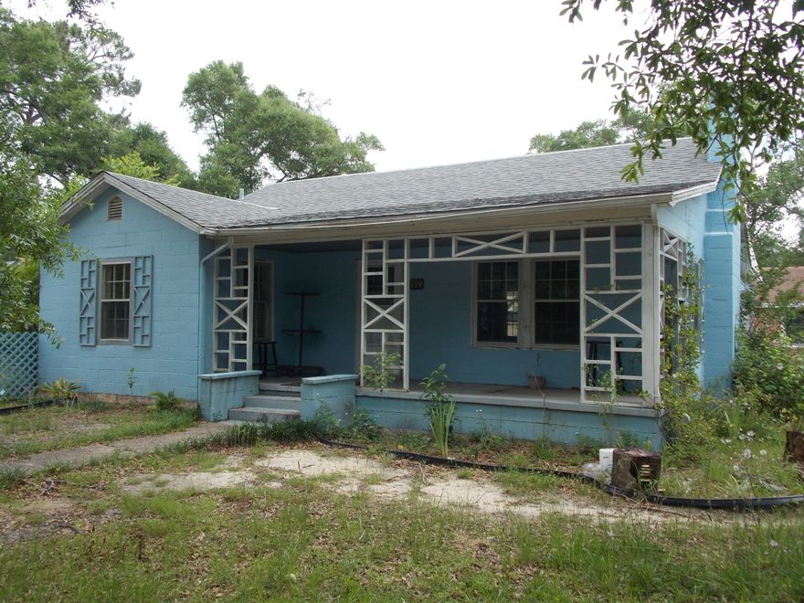 OPPORTUNITY KNOCKING! Great investment property for the right person to renovate and make a beautiful home. There is a 2/1 home and an additional apartment with 1/1. The main home has so much character and potential while the separate apartment could be a source of income or a great guest home. The home has HVAC system and ductwork in place. It is a large corner lot that is completely fenced. Current owners inherited property and have never lived there so they know nothing and cannot make warranties. Home has been consistently rented for years and can be a source of income for the new landlord. Take a look today and don't let the opportunity pass you by!!