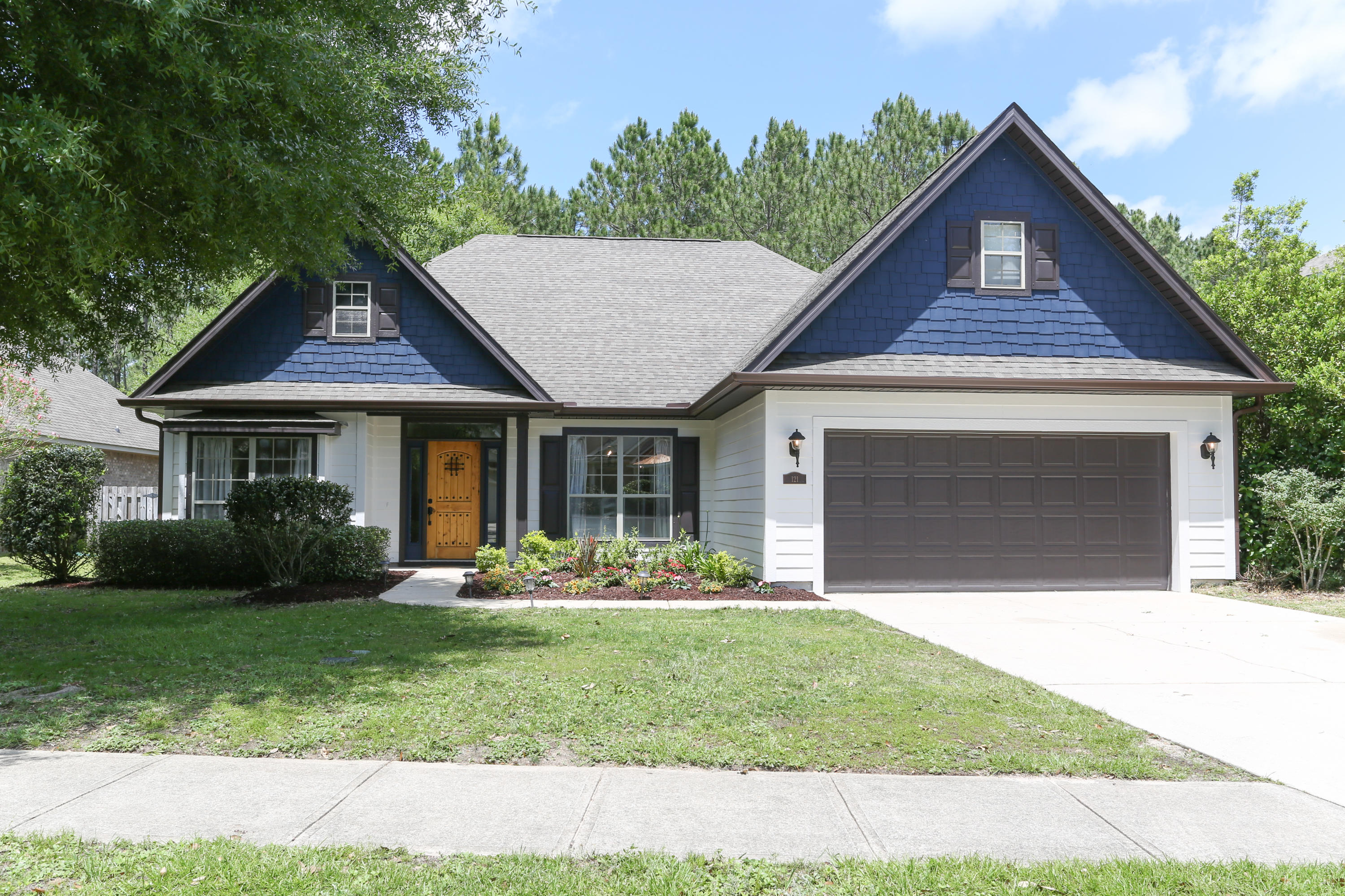 Welcome home to this gorgeous house in Hammock Bay. This home was recently professionally renovated with top of the line materials and design. You'll be greeted with a knotted pine craftsman style front door. As you enter the house the open floorplan, custom lighting and handscraped hardwood floors throughout are sure to impress!The open archways show off a large formal dining room with great natural light, tray ceilings, crown moulding and custom ordered chandelier.The gourmet kitchen features top of the line Bosch appliances, custom cabinetry, a farmhouse sink and luxurious Macaubas quartzite.The kitchen opens up into the living room which features a vaulted ceiling, recessed lighting and an updated gas fireplace. Off of the living room there is a back door that leads(next)
