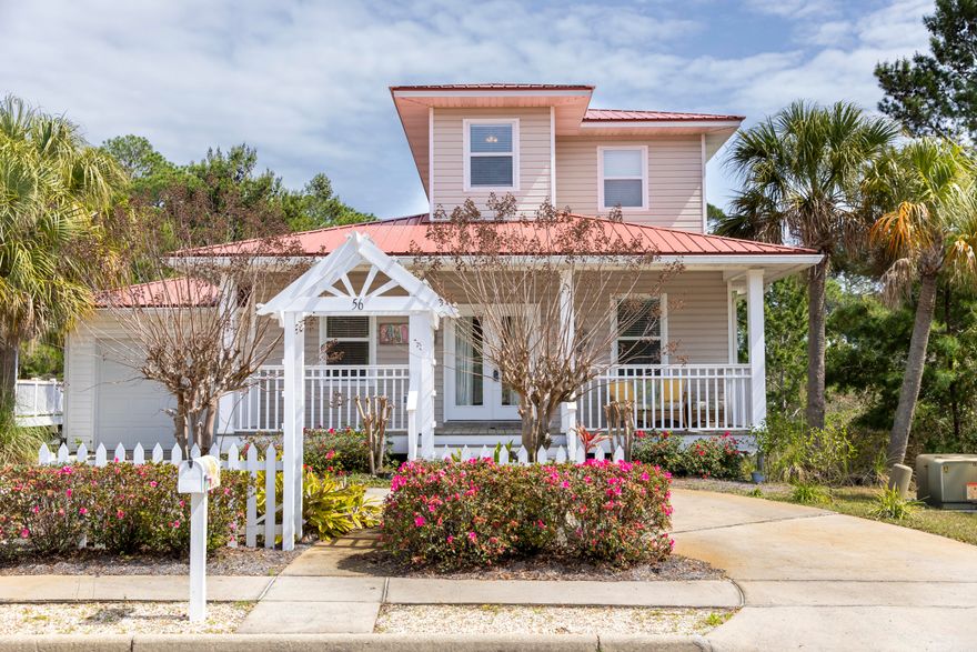 Absolutely perfect Florida Beach Cottage located in the low density Sea Dunes subdivision. This home is surrounded by a white picket fence, wrap around porch, and private wooded backyard. Turn-key, and fully furnished, 56 Tradewinds offers the perfect setting for beach-goers and family alike. The floor plan of this home was designed with family and entertaining in mind with open floor plan on the first floor with kitchen facing out to the living room. The kitchen is a chef's dream with granite countertops and tile flooring. The downstairs is a walkout level with a very large separate living area, and two private bedrooms with a full bath. The upstairs is a master bedroom suite with a small landing area for a reading nook or office area.