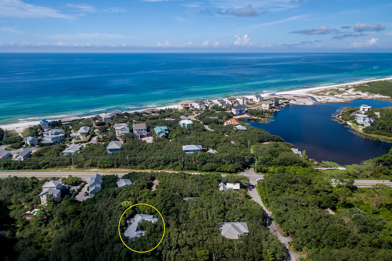 Compelling NEW PRICE !!! Bright and open this completely remodeled home is just one block to 30A and the Beaches of South Walton! Walk, ride your bike or golf cart to THREE beach accesses on the west end of 30A. This fully furnished rental ready home boast an open floor plan with beautiful warm wood floors and wood plank ceilings. A modern redesign and furnishings all while feeling like you're in a tree house among native scrub oaks and magnolias with a wall of floor to ceiling windows!! ***Watch the VIDEO to take a tour*** of this 2 story, 5 bedrooms, 3 bath home. There's room to design and construct a pool on the large lot, approximately 75 X 135. See the pool renderings of the backyard oasis! Easy carport to garage conversion. Call today to see Poppa's Beach House.