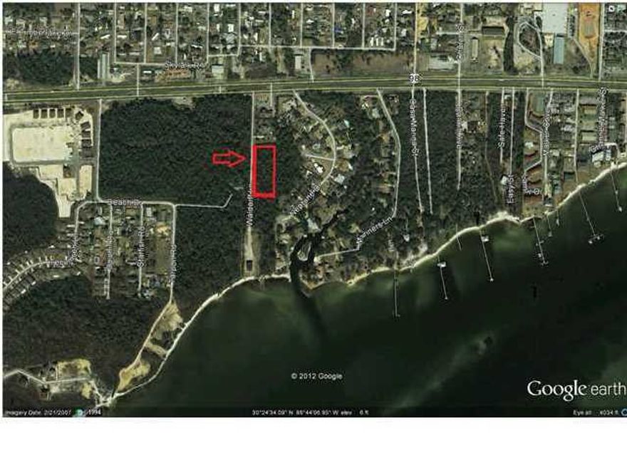 Over an acre of land is available for you to purchase on the south side of the highway with deeded water access! There is plenty of room for you to build your dream home with views of the intercoastal waterway. The seller has building plans for a 2,000 sq. ft house which includes 4 bedrooms and 2-1/2 baths. The home plans were designed around the natural upland area. This property is located in Flood Zone X. Please see attached documents for the boundary, topographic surveys and house plans. Buyer to verify any and all information.--