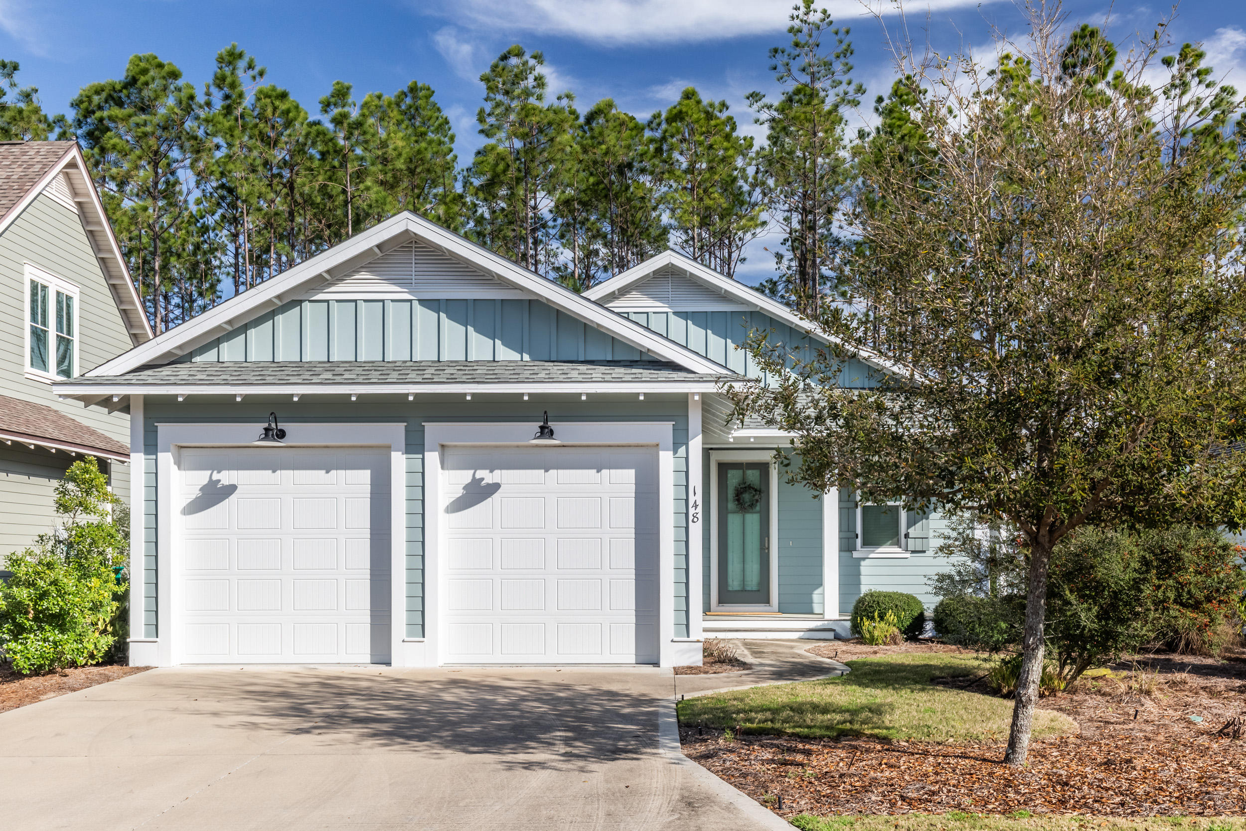 JUST REDUCED by $19,000! Built in 2016 to the newest construction standards, this inviting home with numerous upgrades and lush landscaping, offers 1,910 sq. ft w/3 Bdrms and 3 Baths and a 2 car garage. Upgraded flooring throughout, natural stone Travertine tile in each bathroom, rimless glass showers and more. The kitchen features subway tile backsplash, quartz countertops, stainless steel appliances, gas cooktop and an over-sized eat-in island. The dining room and living room flow seamlessly with the kitchen for an open airy feel. Each guest bedroom is well appointed with ample space for the kids or company. The screened-in porch offers plenty of space for outdoor living and is adjacent to the common area green space for added privacy.