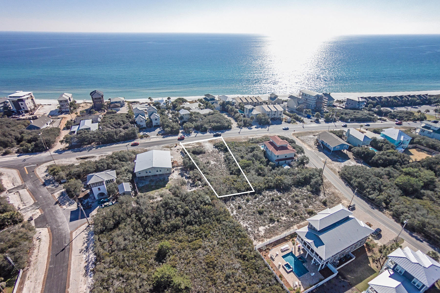 Expansive homsite sitting directly on Scenic Highway 30A, exceptionally located just a few tiers from the gulf-front and immediately west of Camp Creek Golf Course and Alys Beach. This large homesite, 80 feet wide and 160 feet deep, will convey gulf views, and the covenant will allow either a large beach house with a pool or a duplex. Covenants and restrictions provide for duplex. Deeded beach access. Great for two families, a large family, or a high cash-flow investment vacation rental. Rare to find a property situated directly on 30A which will accommodate a duplex or a very large beach house. WATER & SEWER ON SITE/ONE TAP FEE PAID. An exceptional opportunity in a prime location on the east end of 30A!