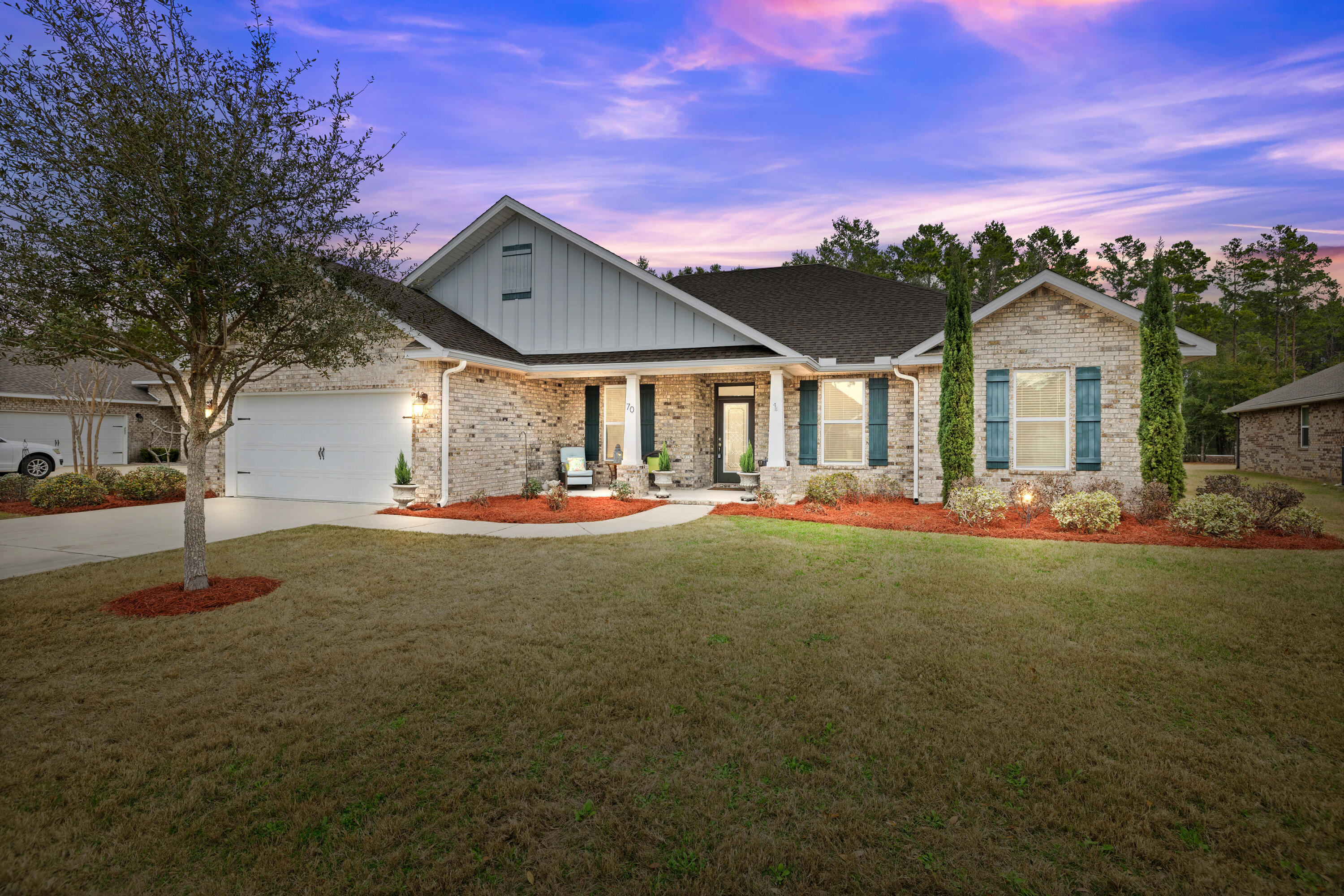 Welcome to 70 Sweet Tea Lane, a stunning 4-bedroom, 3-bath home in the desirable Hammock Bay community. This thoughtfully designed home features an open-concept kitchen and living room, perfect for modern living and entertaining. The split floor plan ensures privacy, with the master suite located on the west side of the home. The kitchen is equipped with a reverse osmosis filtration system, and the home offers ample storage, including a lighted, finished storage area over the garage with pull-down ladder access.The large fenced backyard provides direct access to nearby bike trails, perfect for outdoor enthusiasts.Hammock Bay offers a wealth of amenities, including a community pool, gym, tennis and pickleball courts, a general store, clubhouse, microbrewery, fishing pier, walking t
