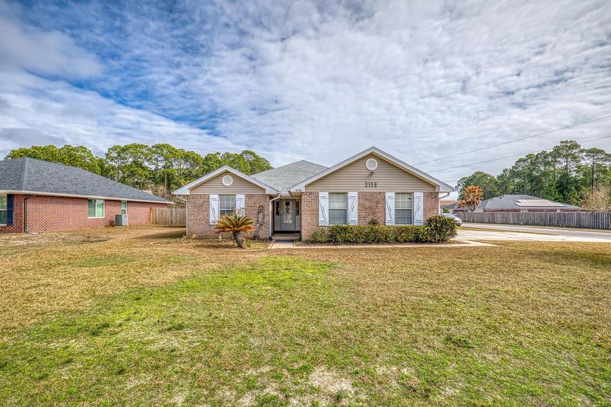 Discover this beautifully updated 4 bedroom home situated on a spacious corner lot just 2 miles from the beautiful Emerald Coast! Featuring Luxury Vinyl Tile throughout, this home offers a bright and open feel. The master suite is a true retreat boasting a 42 inch Jacuzzi tub, stylish shiplap accents and double vanities.  Kitchen features quartz countertops lighted cabinets and a pot filler. This property includes a dedicated RV pad complete with a 50amp hookup and water connection. Outside you will find lockable hurricane shutters, a 10x12 shed for tools and equipment and an expansive oversized patio with enough room for a half court basketball game! Other updates include a new garage door opener and a Smart A/C control. Roof 4 yr, A/C 8 years and a Termite Bond in place.