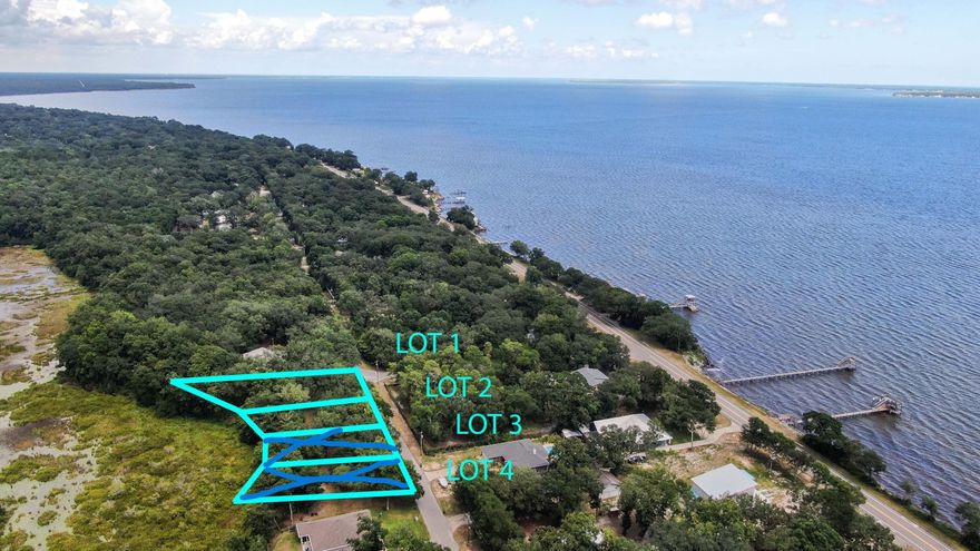 This listing is for Lots 1&2. Take a look at this absolutely breathtaking property just 1 block for Choctawhatchee Bay! This property borders Eglin reservations property. Your backyard will be untouched scenery of wildlife and Hammock Lake. There are water mains on both lots. Seller will owner finance with $20k down. Buyer must verify all measurements to own satisfaction.