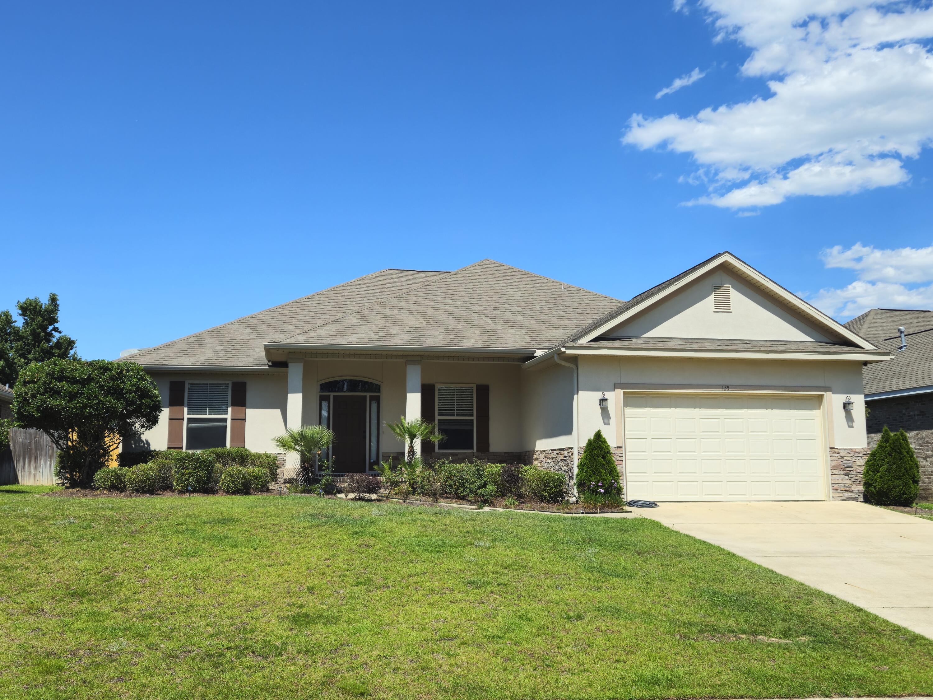 Step into this beautiful 4-bedroom, 3-bath home, nestled among majestic pines in Crestview's Shadow Pines neighborhood. Located just off PJ Adams, enjoy quick access to schools, shopping, and a short commute to Eglin AFB and Duke Field.Inside, 9-foot ceilings soar to 10 feet in the living room and master suite, creating an airy feel. The chef's kitchen boasts granite countertops, custom cabinets, a pantry, and a cozy breakfast nook.Step through French doors to the under-roof lanai, perfect for relaxing or grilling in the expansive backyard, featuring an irrigation system.The Jack-and-Jill bath layout, spacious bedrooms, and single-level design make this home ideal. Freshly painted, with new vinyl flooring in the bedrooms and an epoxy-coated garage floor, it's move-in ready.