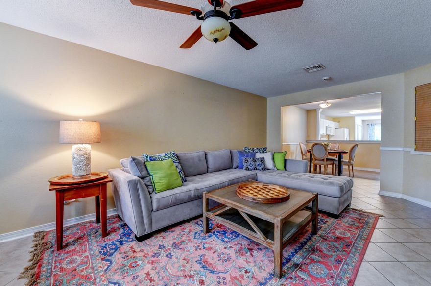 Come see this immaculate 2 Bedroom/2 Bath Townhouse in the family friendly neighborhood of Palmetto Trace. A well-designed floor plan begins with foyer entrance and access to the one car garage; an open concept living area leads to the eat-in kitchen with additional seating at the bar. There's also plenty of room for formal dining area between the breakfast bar and living area. Rear sliding glass door leads to an extended patio, perfect for grilling. Two nice size bedrooms and two full bathrooms complete this ''must see'' townhouse. Brand new Bosch Dishwasher and Hot Water Heater purchased in 2018. Washer, Dryer and Hurricane Shutters convey with the sale of the property.