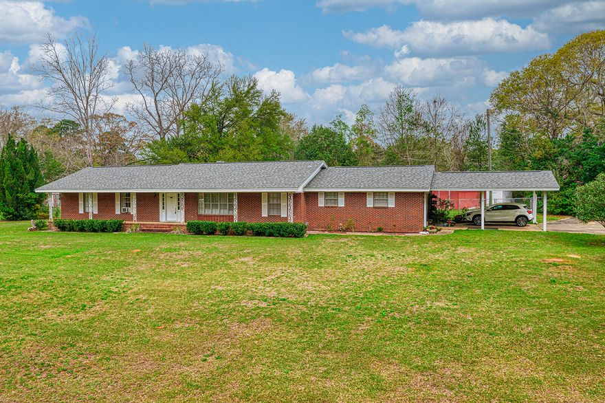 Stately 1965 Brick ranch home sitting on 1.02 acres with 3 bedrooms and 2 baths located at the end of Ridge Drive - fully fenced back yard.   Large front porch and back patio off the kitchen area.   Master has an en-suite with a walk in closest.   Home has a formal living and dining room with bay windows as well as a family room with fireplace and opening sliding glass doors to the back yard. Minutes to shopping, schools, post office and churches.  New water heater installed Feb 2023.   Home has lots of potential but does need some TLC