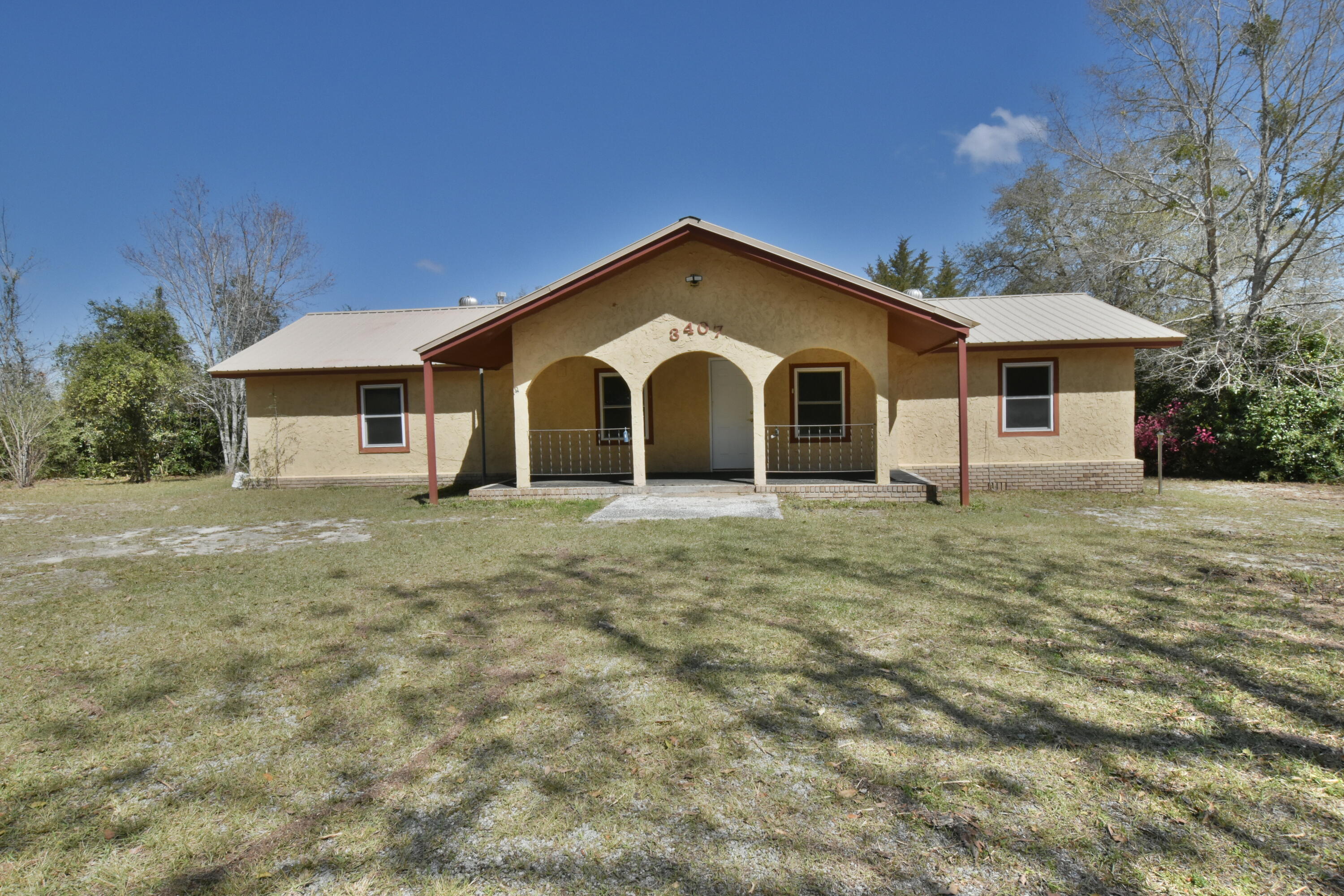 Peaceful country living on this beautiful homestead. This property include a main house with 3 Bedrooms & 2 Baths. A guest house with 2 Bedrooms and 1 Bath. Separate 3 Car Garage with storage room, shower and sauna. Stucco siding and metal roof on the main house and guest house. Updated with paint and new tile flooring throughout. This property is as-is.