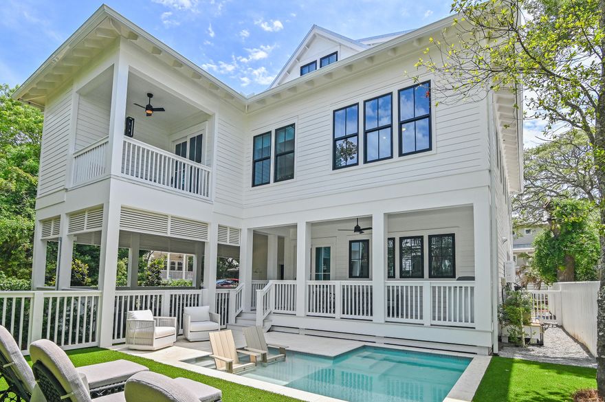 Welcome to 81 Nightcap, a stunning new construction home in the heart of Old Seagrove--just one block from the beach and a short stroll to iconic Seaside. This 6 bedroom, 6.5 bath luxury retreat blends modern sophistication with timeless coastal charm, making it an ideal full-time residence, second home, or investment property. From its crisp white exterior to the designer-selected furnishings & high-end finishes, every detail has been thoughtfully curated to impress. Step inside to an open-concept layout designed for both comfort and entertaining, featuring a gourmet kitchen with top-of-the-line appliances, custom cabinetry, and a spacious island perfect for hosting gatherings. Multiple living areas, generous ensuite bedrooms and a flowing layout provide ample space for friends & family. This custom designed home also includes two primary suites, an ADA-accessible bedroom, an elevator, dual laundry, and is being offered fully furnished and rental ready for added convenience. The entire top floor serves as a media and game room, complete with a foosball table, cozy lounge, and reading area, and leads to a custom built-in bunk room with serene views of the surrounding lush greenery. Outdoor living shines with a private pool, sun deck, and an expansive outdoor entertaining area, including a covered patio and alfresco dining space under the cabana. Whether you're gathering poolside, enjoying morning coffee on one of the many porches, or heading to nearby Seaside for shopping or a meal at "Airstream Row," this home offers the ultimate in 30A living. With plenty of parking and unmatched proximity to white-sand beaches, 81 Nightcap is truly a one-of-a-kind coastal sanctuary.