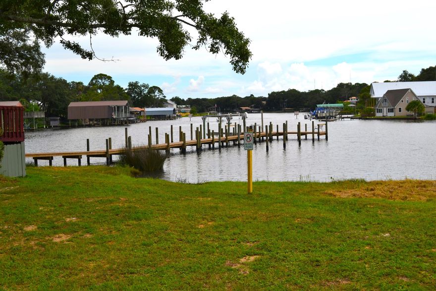 A condo with a view! A great investment for a first-time buyer or investor. Move in ready and being sold furnished. You can enjoy the carefree Florida lifestyle paddle boarding, kayaking of fishing off of the community dock at Cinco Bayou or cool off at the pool with a nice dip overlooking the water. Your unit is situated right at the dock and pool entrance. Minutes from beaches, bases and shopping! This is a great opportunity without the upkeep hassle! It is ready to move in today! Pier One condo does not allow short term rentals or dogs in unit per HOA rules.