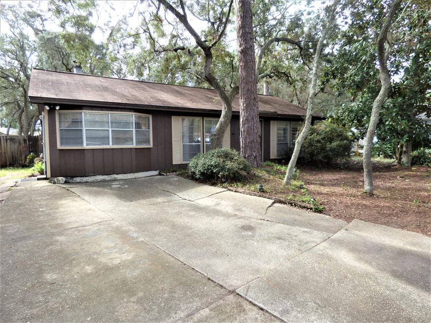 Being sold AS-IS....CASH or RENOVATION LOAN REQUIRED as home will not qualify for traditional financing. GREAT LOCATION in an established neighborhood, Easy accessibility to Eglin AFB, Hurlburt Field, 7th SFG Complex, Duke Field, beautiful beaches, great schools, restaurants, shopping, medical, entertainment, the VA clinic, and is less than 2 miles to bay/bayou public water access.. This 1344 sq ft 3bedroom/2bath home sits on a .26 acre lot. Home needs a new roof,  wood rot repair and updates  however lots of work could translate to lots of potential.  Spacious yard building. PROPERTY IS IN PROBATE AND CANNOT CLOSE UNTIL PROBATE IS COMPLETED --estimated 60-90 days.
