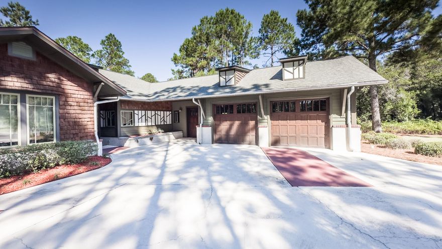 ~~Just reduced by $100,000~~A  finely detailed home of luxury and distinction in the Arts & Crafts style by noted Rosemary Beach architect. George Israel. Features include maple woodwork throughout and cypress ceilings in the great room. The split plan en suite provides privacy for generations sharing one home. The home is handicapped adaptable and was designed to accommodate persons with special needs or aged adults. Located on a large cut de sac lot in the desirable gated community of Wild Heron. Wild Heron is the home of Greg Normans Shark Tooth Golf course. The premier neighborhood amenities include a.workout facility, heated pool with hot tub, fire pit, dock on Lake Powell, playground, kayaks, and boathouse Seller is a licensed Real Estate agent