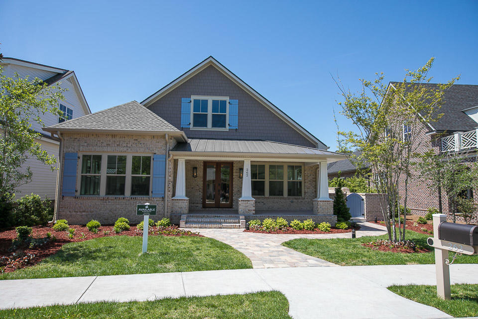 A modern craftsman home, with ''Oyster Bay'' brick exterior is the gateway to a contemporary, open floor plan interior. Jaw dropping custom finishes throughout the residence, include : Cambria Quartz counter tops and backsplash, hand scraped and stained ''Maple Moonshine'' hardwood floors, Thermador Appliances, custom Italian cabinetry by Marquis accented with upper cabinet Italian lighting, soft close drawers and doors,floating shelves and a state of the art pantry with double glass doors. Two sets of triple sliding glass doors provide a seamless transition to the 1500 square foot porch, with ''Firerock'' pavers throughout, heated pool, heated spa and a tanning shelf. The outdoor space houses a custom kitchen with ''Naturekast'' cabinetry,top of the line grill, and Quartz Counter tops.