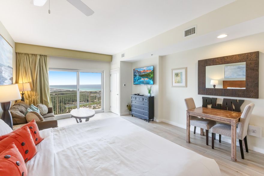 Located on the 16th floor of the sought-after Luau I building, this spacious 469 sqft updated studio offers a serene beachside escape with great east gulf view. The elegant wood-look flooring adds warmth and sophistication, creating a seamless, stylish ambiance throughout the space. Luau is a true resort oasis, boasting a heated lagoon-style pool with a tranquil waterfall, hot tub, grilling area, and a rooftop sundeck with breathtaking panoramic views stretching from the Gulf to the Bay. Stay active in the on-site fitness center or simply unwind and enjoy everything this coastal haven has to offer.Perfectly positioned on the beachside of Sandestin Golf and Beach Resort, Luau is just down from the sugar-white sand and emerald waters of the Gulf, with easy access to all of Sandestin's top-tier amenities via the resort tram.

As an introduction to the Sandestin lifestyle, we invite our new owners to explore amenities that make Sandestin special. The listing brokerage and seller(s) are presenting the buyer(s) of this property with (2) 90-minute rounds of Tennis court time, a golf foursome at one of our three championship courses, and a round of golf for up to four (4) players at the unrivaled Burnt Pine Golf Club.
Sandestin Golf and Beach Resort features more than seven miles of beaches and pristine bay front, four championship golf courses, 15 world-class tennis courts, a 226-slip marina, a fitness center, spa and celebrity chef dining. Shop, dine and play at the charming pedestrian village, The Village of Baytowne Wharf and more. Inside the gates of the resort, residents enjoy a balanced lifestyle of high-class living, spanning the 2,400 acres from the beach to the bay. Everything within the gates of the resort is accessible by golf cart or bicycle. The entire resort is interconnected by miles of pedestrian, bike and golf cart paths that weave through groves of live oaks, meandering past natural lagoons, fountains, man-made lakes, and meticulously landscaped fairways.