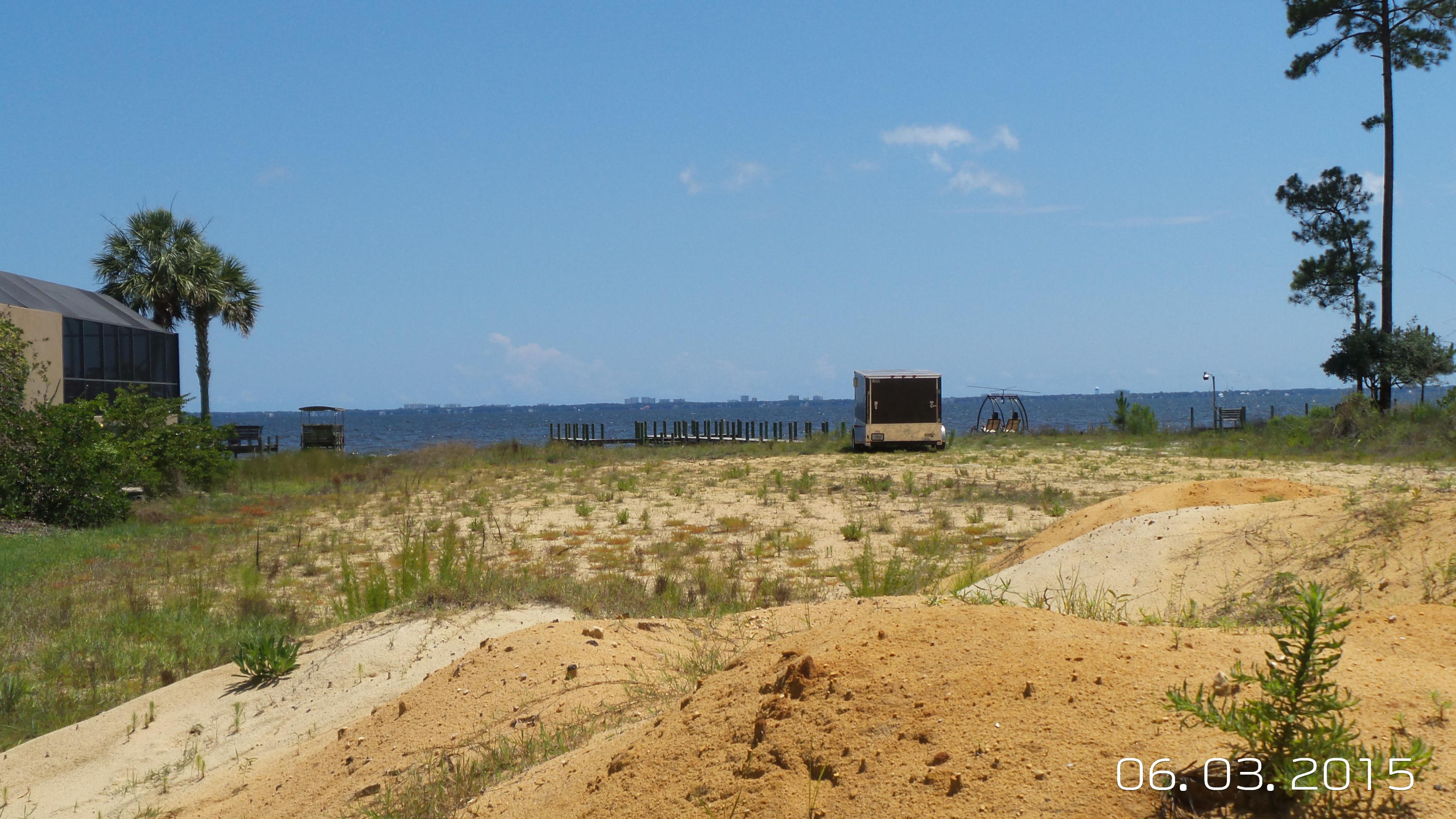 Prepare to be amazed by the views all the way to the Destin Bridge. Build your dream home on this great lot!! ALL THE WORK HAS BEEN DONE! It has been CLEARED and back filled. It has a DOCK, SEAWAL and RIPRAP in place. This lot is ready to build. Survey and elevation cert already done as well as compaction test. Listing agent has ownership interest.
