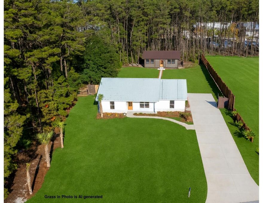 Discover a rare opportunity for multi-generational living, income potential, or simply the luxury of extra space at 65 Happy Hollow--a beautifully remodeled property offering exceptional versatility on a peaceful 0.57-acre lot in Freeport.The main home features 3 bedrooms and 2 baths, fully redesigned from the ground up with modern finishes, an open layout, and thoughtful attention to detail. A brand-new Accessory Dwelling Unit (ADU) sits just behind the main residence, offering 1 bedroom, 1 bath, a full kitchen, and its own living room--ideal for extended family, guests, or rental income thanks to the area's minimal restrictions. (Bedroom/bath count reflects both dwellings combined.)Inside the main home, you're welcomed by a bright, expansive living area featuring vaulted ceilings with exposed beams, recessed lighting, and a white wood-paneled ceiling that enhances the coastal-inspired charm. Large windows fill the home with natural light, while a modern electric fireplace adds warmth and character.

The beautifully updated kitchen is a chef's delight, offering white cabinetry, quartz countertops, stainless-steel appliances, a farmhouse sink, and brass fixtures. Hardwood flooring flows seamlessly throughout the home, creating a unified and elegant living space.

Bedrooms are generously sized with large windows overlooking the natural surroundings. Bathrooms showcase standout design, including a walk-in shower with iridescent teal tile and gold fixtures and another with stylish star-pattern flooring. With five total closets and a well-designed hallway layout, storage and functionality are abundant.

Outdoors, the spacious lot provides room to relax and enjoy the natural beauty of Happy Hollow. The property includes a paved driveway with ample parking, partial fencing for privacy, and open green space with room to breathe.

The private community dedicated boat launch allows you to enjoy the beauty of nature on Black Creek which leads to the Choctawhatchee Bay via boat, kayak, or paddleboard. Fishing, swimming, and watersports are all at your disposal with this nearby boat launch.

Perfectly located, the home sits just 2.4 miles from US Hwy 331, approximately 5 miles to downtown Freeport, and under 10 miles to Hwy 98offering easy access to shopping, dining, schools, and the beaches beyond the 331 bridge while still maintaining the peaceful charm this area is known for.

Whether you're looking for flexibility, privacy, investment potential, or a beautifully updated home in a serene setting, 65 Happy Hollow delivers it all.

Grass in 1st photo is AI Generated to give you an idea of what it can look when the whole property is seeded in grass.

Schedule your showing today and experience the opportunity this unique property offers.