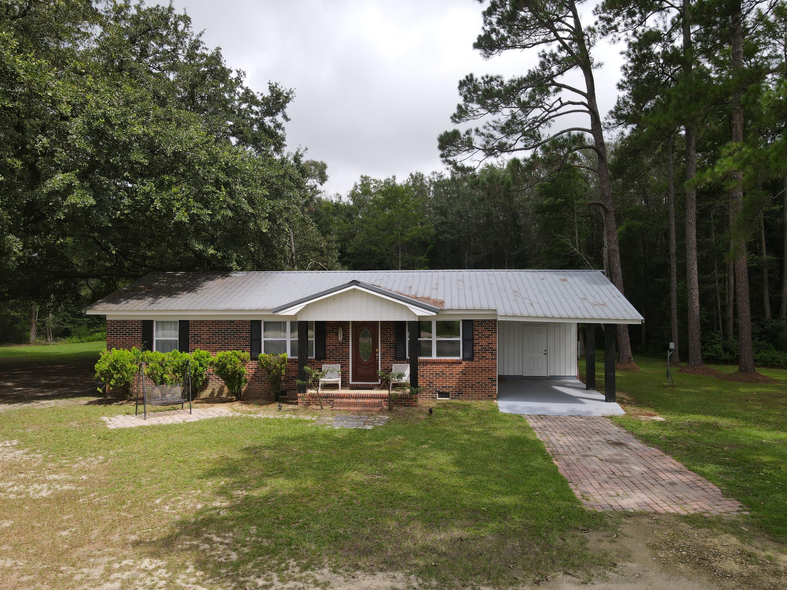 Spacious 4-bedroom, 2-bath brick home on 3 acres in Samson, Alabama! This charming property offers the perfect blend of modern updates and country living. Inside, you'll find an updated kitchen with stylish finishes, a comfortable master suite with a beautifully renovated master bath, and plenty of room for family or guests. Outdoors, enjoy a small pond tucked away in the back, ideal for peaceful views and relaxation. The property also includes a workshop and storage barn, giving you plenty of space for projects, equipment, or hobbies. Conveniently located just off Hwy 87, this home combines privacy with easy access to town. A wonderful opportunity to enjoy the best of Southern living!