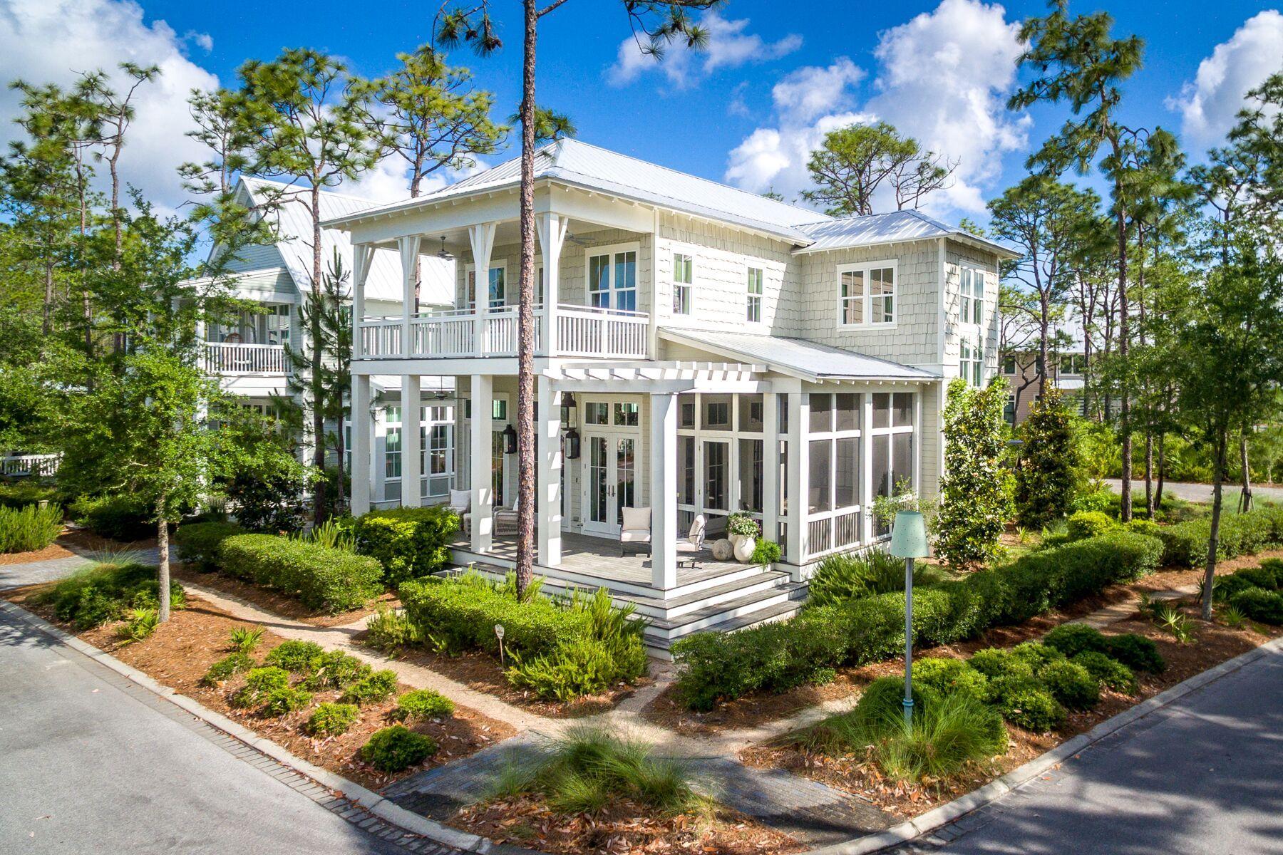 Effortlessly situated on an oversized corner lot overlooking Muhly Park in the Crossings District of the coveted community of WaterColor, this 3,068 square foot beach house is perfectly positioned to allow natural light to flood the home at the most favorable times of the day. This spacious four-bedroom beach house wrapped in authentic cedar shake exudes coastal charm boasting deep, wrap around porches, 12-foot ceilings, beautiful hardwood floors, transom windows and soaring shiplap walls throughout. The expansive covered front porch and double door entry welcomes you to this two-story home that offers an open concept floor plan created with families in mind. A wall of windows illuminates the home's great room which features a large living room area, spacious dining room with seating for
