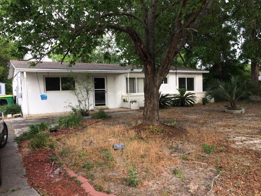 This conveniently located, 4 Bedroom 2 bath home in Mary Esther would make a great starter home or a good opportunity for an investor looking for a 4/2 in the area. Large front windows bring plenty of light into this home. Behind the dining area through a glass sliding door is a screened back patio that adds additional outdoor living space. The floor plan is split with the master bedroom/bath entered through the living room. The additional bedrooms are all similar in size with good closet space. The utility/laundry room is located behind the kitchen and has a pantry area plus another exterior door. The roof was replaced in 2010 complete with hurricane clips and new windows were recently installed. Wiring is copper. The kitchen could be easily expanded to a more modern design.