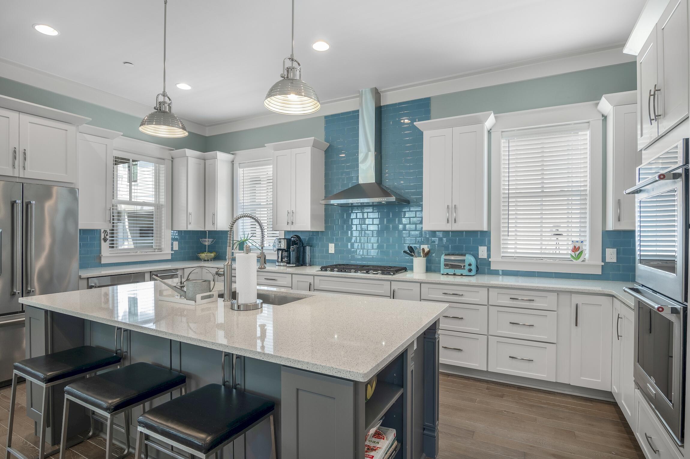 Set in an exceptional location close to Eastern Lake and beach access, this custom built beach cottage is hard to surpass. The condition of this home reflects the pride in ownership of the owner occupants who have never rented the home and the quality of Luke & Blue's construction. Inviting indoor and outdoor living space along with a fabulous chef's kitchen provide the perfect backdrop for making wonderful memories in your 30A home. Cooks and entertainers will appreciate the gourmet kitchen, which is filled with light from the windows and pendant lighting above the generous island. Above and beneath the quartz countertops, there is abundant storage. The stainless KitchenAid appliances include double ovens, a beverage refrigerator, ice maker and a five-burner gas cooktop. The dining area