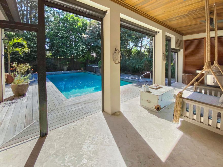 Built in 2003, this home has all the latest appliances, granite counter tops, stainless steel appliances, travertine floors, high ceilings, 16x32 pool, built in bookcases, and a gas fireplace with large flat screen tv and surround sound system included. This is a one story very open floor plan featuring a spacious screened porch with Mahogany privacy screen that opens to large fenced backyard and one of the largest swimming pools in the Vineyards. You have your own resort in the backyard.  All 3 bedrooms offer privacy with locations separated in the home.