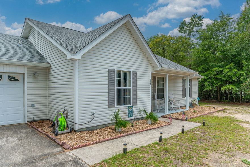 Welcome home to this well maintained cozy home located only a short distance from Crestview and the beautiful sandy beaches of South Walton. This home features a split floor plan on nearly an acre of land with a large walk-in closet in the master bedroom. Fresh paint throughout, updated laminate flooring that sellers are also completing in the bedrooms to eliminate carpet. completely. Home has updated fixtures throughout and freshly painted cabinets. Outside you will find a newly built pergola with a roof and additional pavers for relaxing by the fire pit in a large oversized fenced in yard. You will find the additional land behind the home beyond the farm gate located in the backyard. You don't want to miss this one! Roof was installed in 2017, HVAC and gutters installed in 2020!