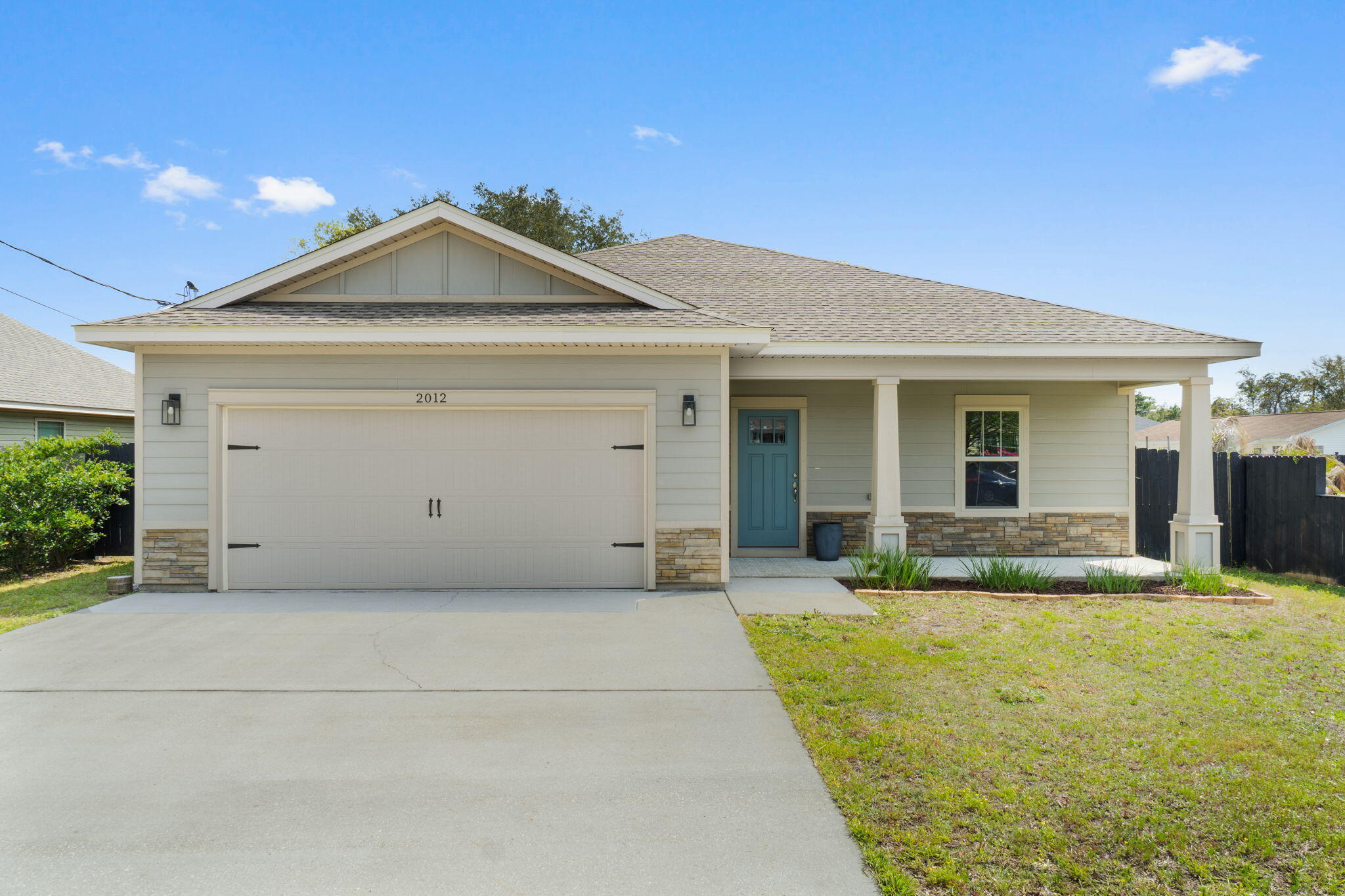 Welcome home to this stunning craftsman style Ramsey & Walker built east Navarre home improved with lovely customizations featuring 3 bedrooms and 2 baths just a half a mile from the Navarre Beach Bridge! You'll love the easy commute to Hurlburt Field while also being only minutes to Navarre's beautiful beaches. Pull up the driveway in front of the two car garage and walk to the front door where you'll find an adorably painted covered front porch inviting you in. Through the threshold a long open entryway will greet you with a trey ceiling accented with crown molding and a front entry closet and accent wall with board and batten. The open floor plan awaits you with a large living space adorned with hard surface flooring open to the stunning kitchen. Adorned with all the updated features you're looking for, you'll love the custom tall cabinets with tasteful hardware, the granite counters, the large island with plenty of room for seating, the stainless steel appliances, tasteful tile backsplash, drop down pendant lighting, and the spacious pantry. Off the kitchen is the dining room featuring another trey ceiling and a gorgeous accent wall, and the back door leads outside to the fenced in backyard complete with a sprinkler system, mature oak tree, and fire pit! Back inside the split floor plan features bedrooms on either side of transom windows which provides a nice high end custom touch. The master bedroom is a fantastic and spacious retreat with a trey ceiling and crown molding and a master bathroom with gorgeous granite double vanities, a tiled shower with soaking tub, and a massive walk in closet! The other two bedrooms on the other side of the home are nice sized with ample closet space, and a beautiful bathroom with matching finishes between them along with a hall closet. The interior laundry room has the same tiled floor as the bathrooms and leads to the garage.
You're minutes from Navarre Beach, Navarre High School, the YMCA, Navarre Youth Sports Association, as well as dog parks and walking paths. Don't delay in making this your perfect retreat for a primary residence or investment property!