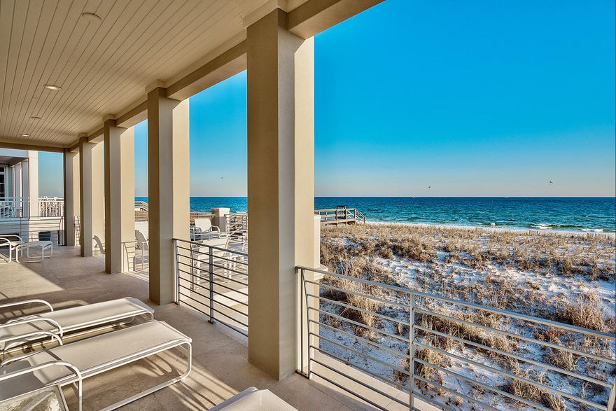 Modern elegance juxtaposed contemporary coastal design define this sophisticated all concrete beach front residence ideally situated in Destin Pointe featuring panoramic views of the white sand beaches and emerald green water of the Gulf of Mexico & Destin's East Pass. Careful attention to detail was taken designing this modern marvel with notable upgrades including multiple outdoor terraces to maximize gulf, lake & harbor views, private elevator, contemporary floating staircase with custom travertine and steel stair treads & railing, framed concrete construction, a reverse osmosis water filtration system, central vac and an oversized parking area with enclosed garage as well as a carport. The interior floor plan is bright, open & airy with an ample amount of windows allowing for optimal