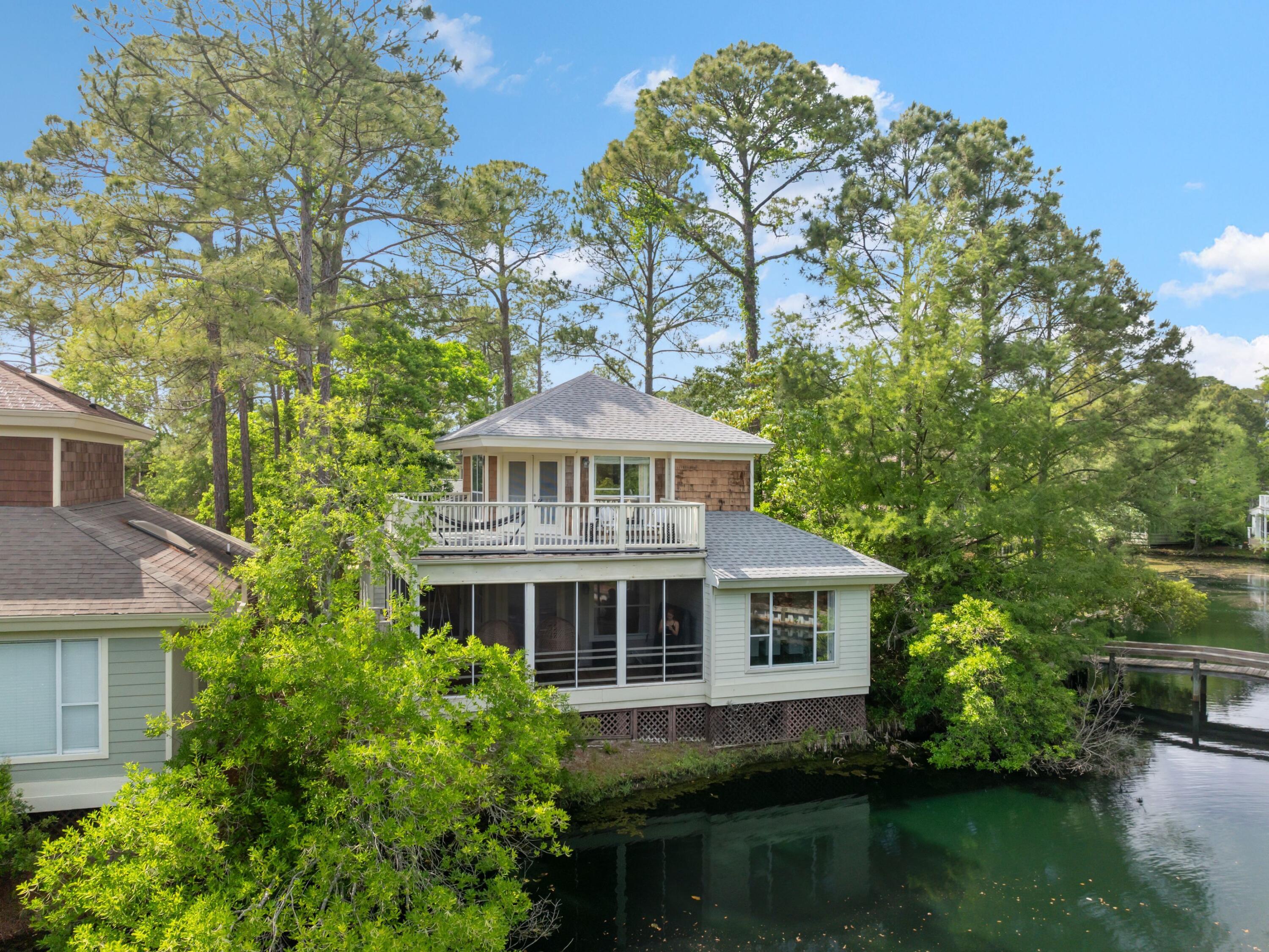If you care about ROI, then you need to check out this vacation rental investment! Verified and consistent rental income on this super cute 3-bedroom, 3-bath Florida cottage located on the lake in the heart of Sandestin Golf & Beach Resort. This home is a proven rental property with a loyal following and offers the perfect blend of charm, comfort, and convenience.With 1,716 square feet, the layout includes two guest bedrooms and two full baths on the main floor, and an upstairs primary suite with a private balcony overlooking the lake. One of the downstairs bedrooms has custom bunk beds adding extra sleeping space and fun for families or guests. The home was freshly painted on the interior in 2024 and features all-new lighting, updated furnishings, and stylish coastal decor throughou The kitchen opens to a spacious living and dining area that leads to a screened-in porch ideal for relaxing while taking in the tranquil water views. Granite countertops, stainless appliances, and wood floors complete the picture.
The location is exceptional and is within easy walking distance to the Village of Baytowne Wharf, the Phil Hummel Aquatic Center community pool (just down the street), the Sandestin Marina, and the tennis and pickleball courts. You can enjoy everything the resort has to offer from beach access and golf to shopping and dining at nearby Grand Boulevard.
Whether you're looking for a turn-key rental investment or a relaxing getaway, this Baypine cottage offers it all!