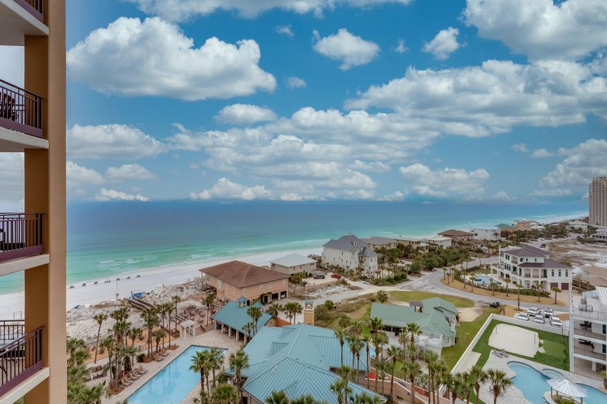 Take in the breathtaking Westerly views from this 10th floor 2 bedroom 2.5 bath premier condominium.  These magnificent views can be enjoyed from the private balcony and can also be seen from each room within the condo. The open living and dining area are complete with tile flooring and crown molding. In the kitchen you will find custom cabinetry and granite counter tops. The master bedroom has access to the balcony as well as an en suite bathroom with double vanity and large walk-in shower. The guest bedroom also has a full bath with large walk-in shower and there is an additional half bath for convenience.