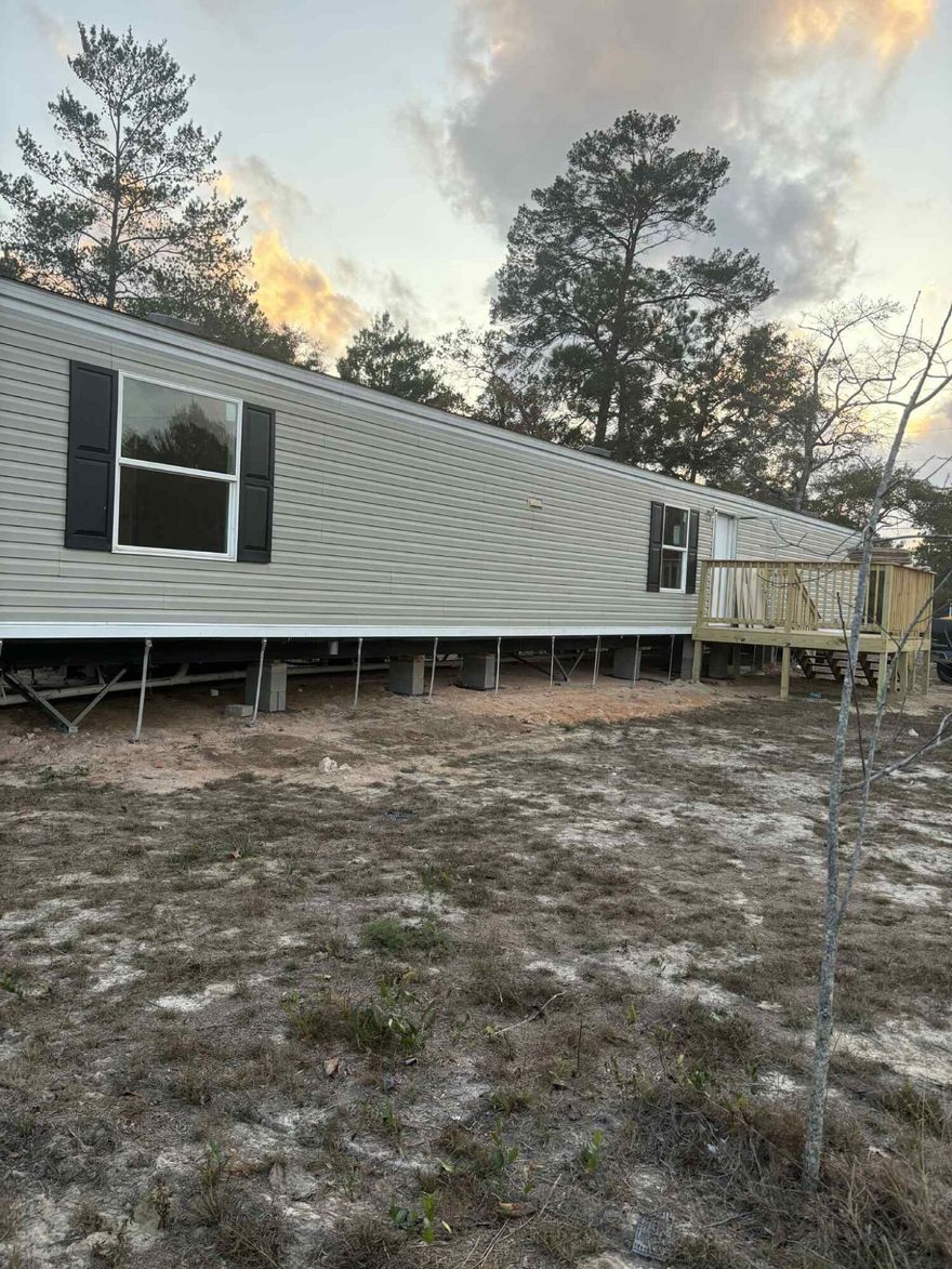 Don't miss this amazing opportunity! This beautifully updated 3-bedroom, 2-bath 2017 mobile home sits on a spacious 0.42-acre lot and is packed with upgrades. Enjoy brand-new flooring, fresh interior paint, and soon-to-be-completed brick skirting that adds fantastic curb appeal. The yard is partially fenced and recently improved, offering the perfect space for pets, gatherings, or future additions. Plus, the washer and dryer are included, making this home truly move-in ready. A perfect blend of comfort, value, and outdoor space. Schedule your showing today!