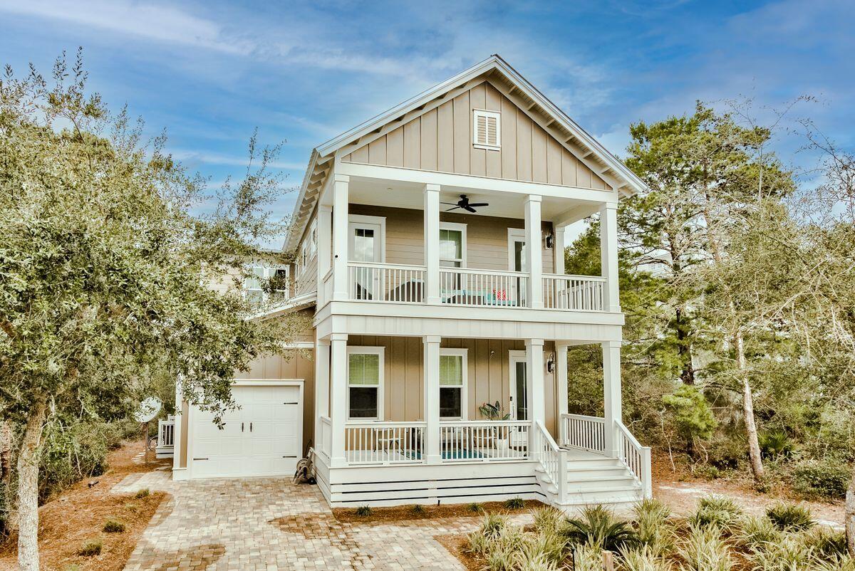 Peaceful green views and a grand entrance characterize this 3,166-sq.-ft. home on one of the largest lots in sought-after Highland Parks. Built in 2018, this four-bed, four-and-a-half-bath retreat in Blue Mountain Beach was constructed by Coastal Custom Home Building and looks and lives brand new with limited occupancy since construction ended. Spread over two floors, this home has been very well cared for. Guests are greeted by a traditional front porch, which sets the tone for the crisp, pristine interiors.