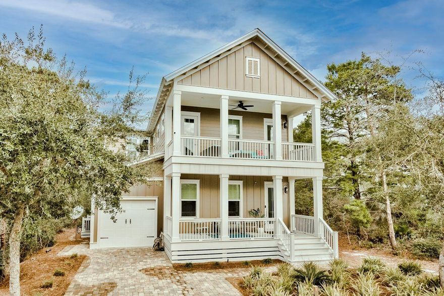 Peaceful green views and a grand entrance characterize this 3,166-sq.-ft. home on one of the largest lots in sought-after Highland Parks. Built in 2018, this four-bed, four-and-a-half-bath retreat in Blue Mountain Beach was constructed by Coastal Custom Home Building and looks and lives brand new with limited occupancy since construction ended. Spread over two floors, this home has been very well cared for. Guests are greeted by a traditional front porch, which sets the tone for the crisp, pristine interiors.