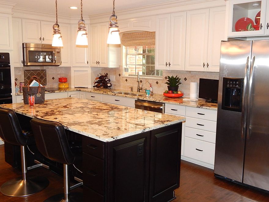 Incredible interior renovation in 2013, this property is a must see for the quality & value!!! This 3/3 one story Ranch has an open floor plan for entertaining w/ a split bedroom design, dream kitchen w/ stainless appliances, granite countertops, huge island w/ breakfast bar, lots of wood cabinets w/ soft closing doors & drawers, pantry, pull out shelves, under cabinet lighting,double wall ovens, smooth top electric cook top that is plumbed for natural gas. Greatroom and 2 of the bedrooms open on to a large deck and in ground pool that overlooks #7 fairway on FWB Pines Golf Course. The renovation included hardwood floors, crown molding, wide baseboards, recessed lighting, natural gas logs in fireplace and built-in bookcases. For your convenience the house is equipped with: MORE