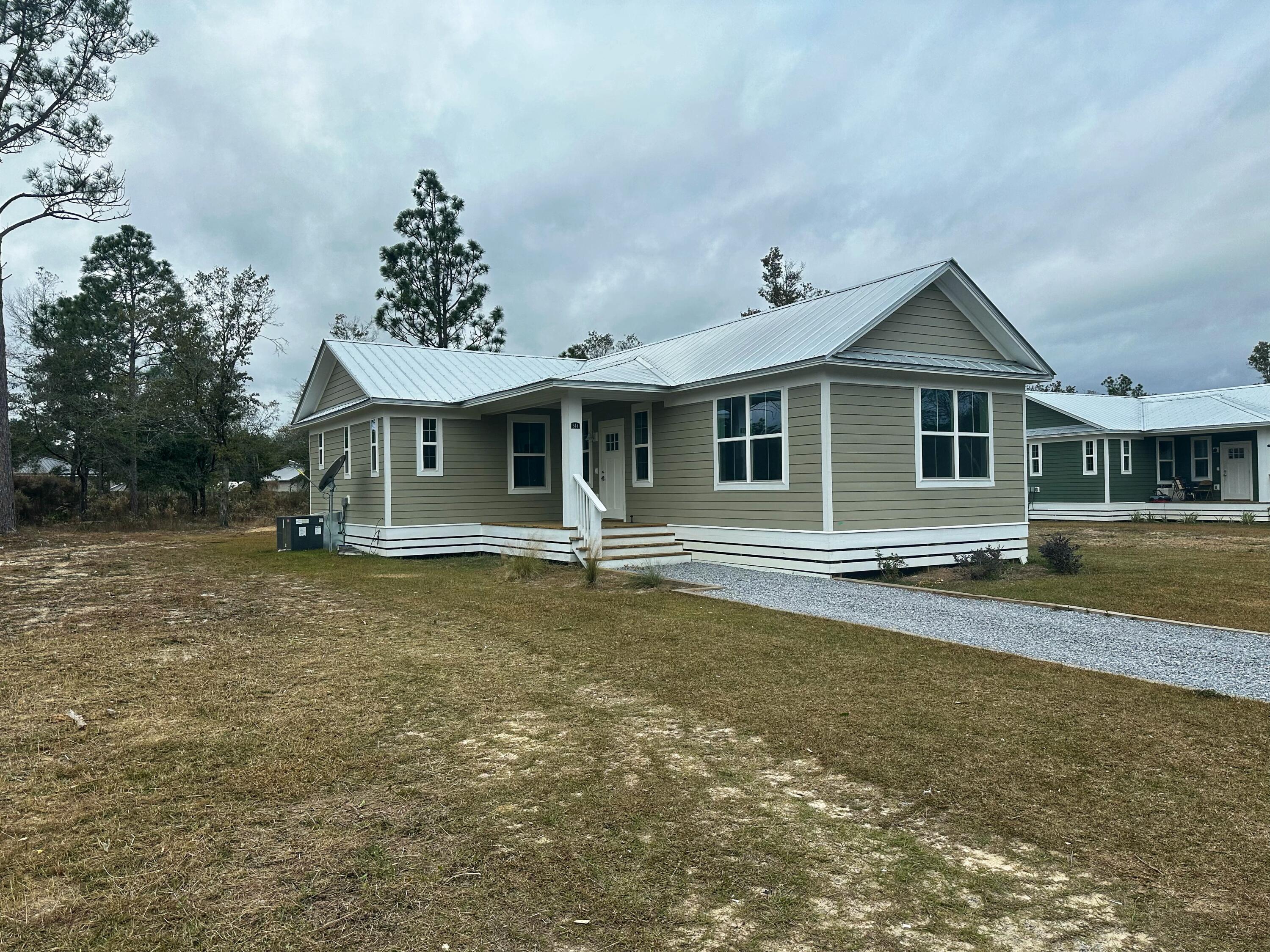 Like New! 3 bedroom 2 bathroom piling home. This build features vinyl plank flooring throughout the entire home with an open-floor layout. In the kitchen, there are stainless steel appliances, shaker style cabinets & quartz countertops. The master bathroom has a stunning tiled shower and walk-in closet. Call today for a showing!