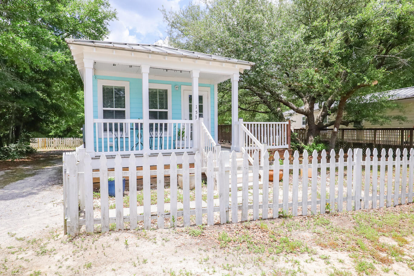 Adorable Florida Cottage with a large open deck wrapping around the front and down the length of the home. Featuring crown mounding, granite countertops, and LVP flooring. Built strong to withstand 165 mph winds, with double-pane windows, metal roof, Hardie board siding, extra insulation for energy efficiency. The home has been part of a rental portfolio generating $1700/monthly. Enjoy a larger yard (approx 1/4 acre), or build on the adjoining lot, all tap fees are paid!