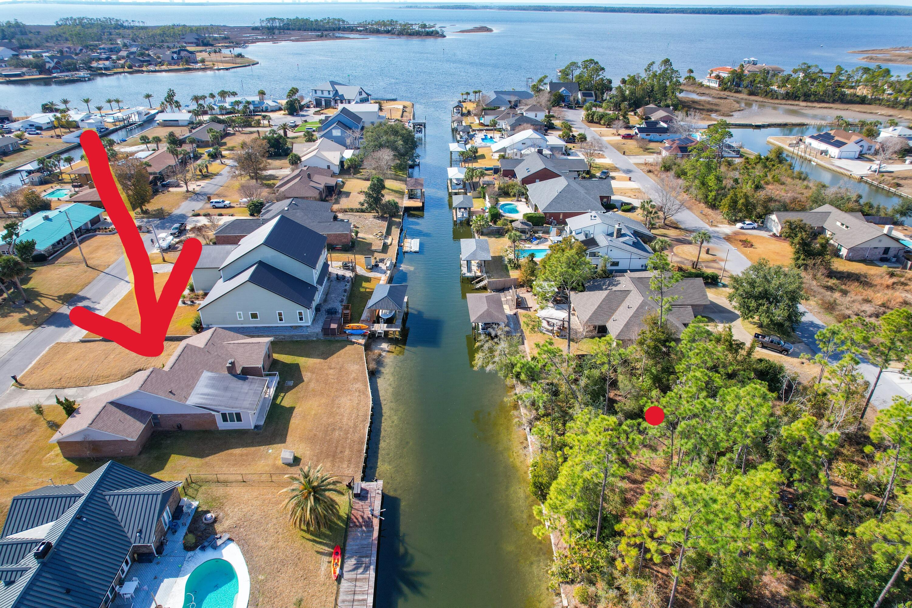 NO HOA and Gulf Access. Welcome to this one owner 3bedroom 2 bath home, nestled in the golf cart - friendly Northshore area and near the city of Lynn Haven parks, community events and public boat ramps. With 2185 sq ft of spacious living, this property provides a fantastic opportunity to create your own updates and personalize it to suit your style. With Gulf access via the canal and North Bay, water lovers could enjoy the convenience of boating right from your backyard. The large foyer creates a welcoming first impression while the large open family room is perfect for both relaxation and entertaining, featuring skylights, a wet bar and wood burning fireplace. A separate dining room adds a more formal touch.. The sunroom overlooks the canal