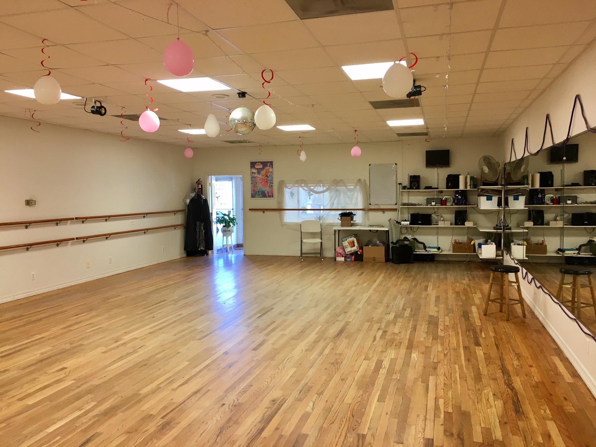 This unit was a dance studio. There is one ADA restroom and the rest of the space may be left open. If needed, the wooden dance floor may remain.