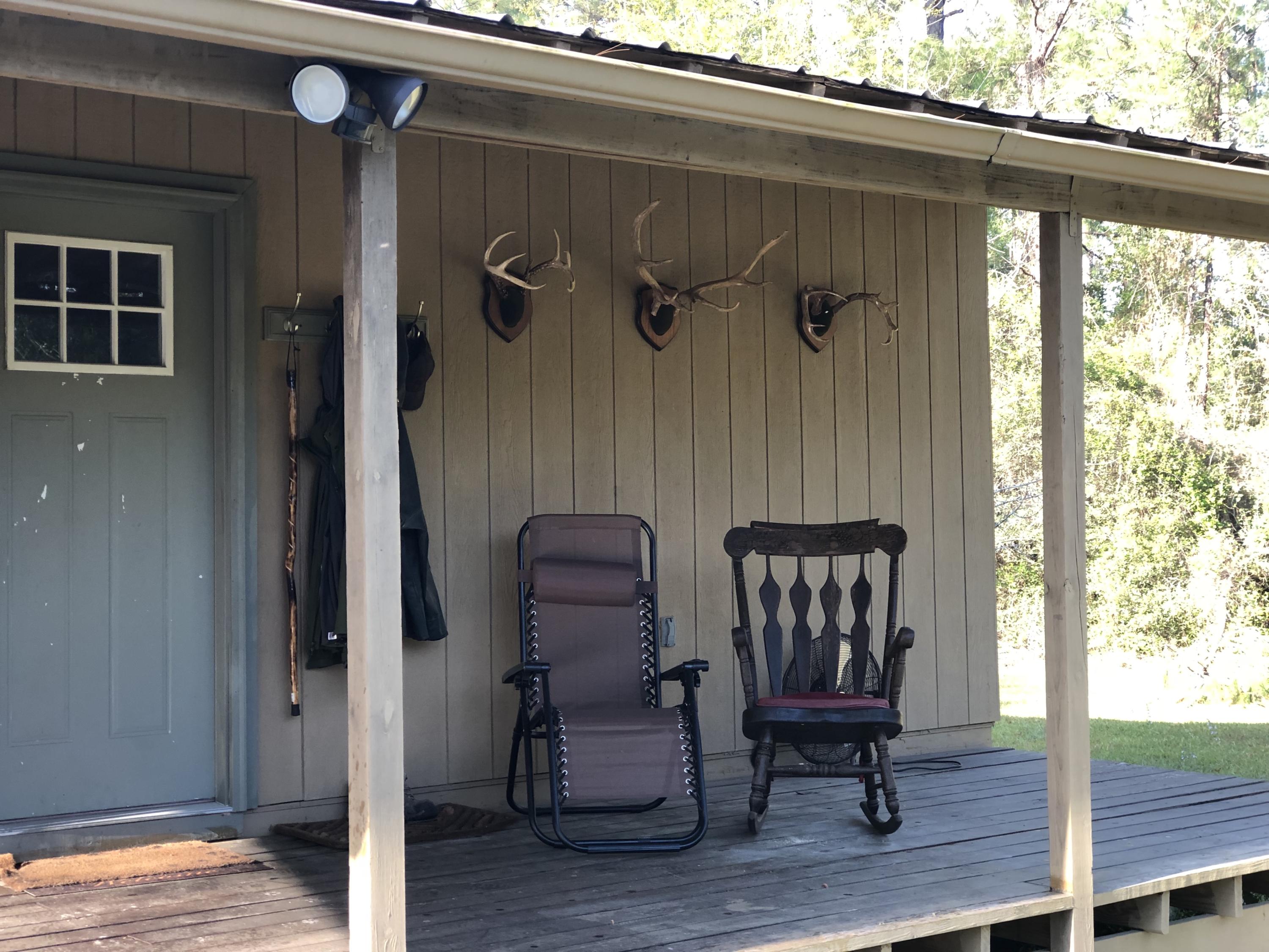 Destination Dream Cabin! Two Ponds surrounded by the Blackwater forrest with paved rd frontage. Bring your camera for wildlife watching or your Hunting equipment and you fishing pole! Two Ponds, with a rocking chair front porch Cabin. Build your dream home on the Hill overlooking the pond and the massive Live Oaks! Bring the Horses and the four wheelers for a private Get away Near Crestview, Munson, Jay and Milton.