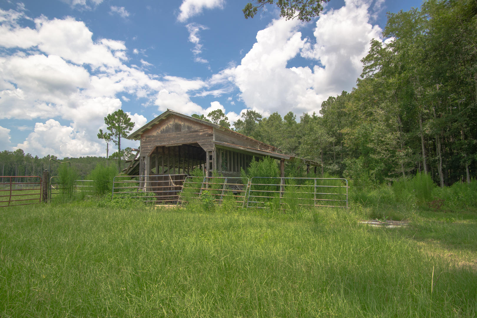 #BeautifulAcreage - As you journey to this amazing property you will love the picture-perfect ambiance surrounding this magnificent property. If you LOVE nature - this property offers so much peace and tranquility. Live the life of serenity and take advantage of the rare opportunity to be the next owner. Featuring 60 acres of paradise, Property is completely fenced as well as cross fenced. There is self-watering in two pasture fields - excellent for cows or horses! The property also features a silo. Even with this spectacular natural setting, this property is actually per-fectly situated on a paved road and is close to the interstate and has road frontage on Lloyd Lane making it easy to split up! Make an appointment to tour this fabulous property today!