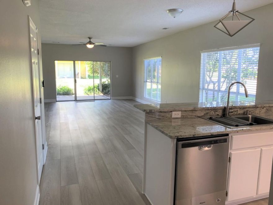 This 3 bedroom 2.5 bath town home is tucked away in a private neighborhood, yet very close to the beach. This is an end unit with extra window for more sun light. The property has been totally renovated with flooring, paint, granite counter tops and appliances. It really is a must see and won't last long. It can be used as your primary residence or bought as an investment property. All dimensions to be verified by the Buyer.