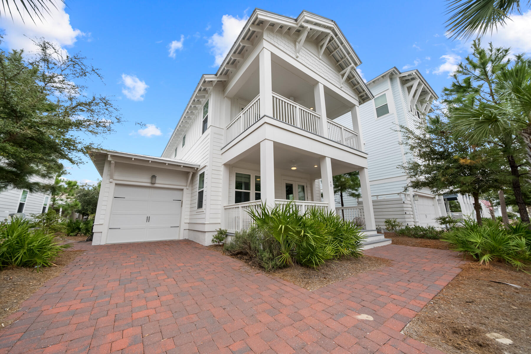 Escape to 30A in this modern coastal home in the heart of Prominence. This is a prime location situated between Watersound and Seagrove, with two beach accesses a short stroll away and just steps away from The Big Chill which offers multiple dining options, boutique shopping and entertainment daily! 40 W Crabbing Hole Lane is the perfect investment property or vacation home offering modern luxury living, an ideal location and memories waiting to be made.Step into this light, bright coastal charmer that features an open floor plan, 4 bedrooms, 3.5 bathrooms and a 3 covered porches you'll use year-round in Florida. This home is offered fully-furnished, turn key with a golf-cart included and ready to rent! From the moment you arrive, you'll be fascinated with the design of the beach community of Prominence. Full of charm, amenities and with short term rentals allowed, in the town of Prominence you're greeted by families riding bicycles, neighbors walking their dogs, and friends walking back from The Big Chill with margaritas! Upon approach, you'll notice this home faces southwest allowing you to enjoy the beautiful sunsets nightly from the comfort of your own on home on two spacious covered porches. Walk in the front door and you're greeted by wide open spaces with custom woven window coverings, hardwood floors and coastal shiplap clad walls. The kitchen is stunning with quartz countertops, upgraded stainless appliances, large peninsula with seating and a walk-in pantry. The oversized windows also allow natural light to flood in year-round blending perfectly with the modern, bright interior design.

Behind the kitchen, you'll find a convenient powder room for guests, the laundry room, access to the large screened-in porch and a highly-desirable main level primary suite. The primary suite features lovely natural light, modern furnishings, a tiled walk-in shower, double vanities and a walk-in closet. The screened-in porch is where you'll be watching football during the fall and movies during those summer nights at the beach. Spacious enough for dining and relaxing, this outdoor living space is an entertaining dream overlooking the common green area of the neighborhood allowing for beautiful landscaped views. 

Offering a well-thought design and floor plan, the upper level features a nice loft area at the top of the stairs giving access to the three additional bedrooms and a guest bathroom. One of the three guest bedrooms is a junior suite with a private en suite bathroom and a large walk-in closet making it a great home for multiple families. The two additional bedrooms give access to the covered porch on the front of the home making it a great place to enjoy coffee each morning when you wake up before everyone else! 

Step into paradise on 30A in Florida and own your own slice of paradise in Prominence. This community offers 2 community resort-style pools, a fitness center, pavered sidewalks throughout and lush landscaping. Surrounded by crashing waves on the sugar white sandy beaches and blending perfectly with southern coastal charm, the 30A area is one of the hottest vacation destinations in the south. This unique gem in Florida offers fine dining, the best hospitality, walkability and biking catering to an active lifestyle. 

Prominence is located adjacent to The Big Chill also known as the world's largest back yard and features dining, shopping and entertaining for the whole family. You're just minutes from famed Rosemary Beach and the town of Seaside. You're also just steps from world-class amenities at the Watersound Club and if you choose to join as a Member, you'll enjoy private beach access, multiple restaurants and bars, tennis, resort-style pools and more.

Get ready to live your best life on 30A!