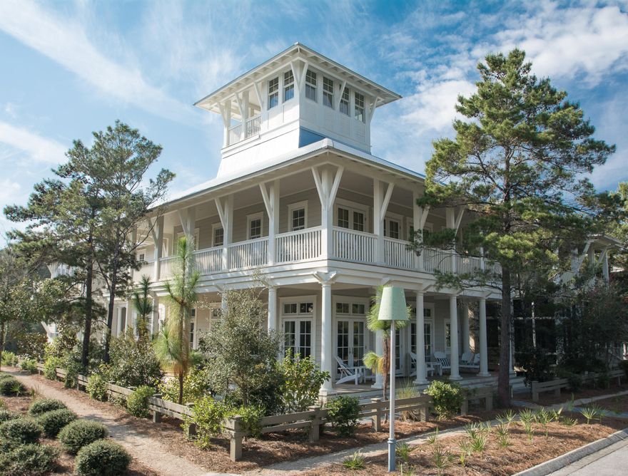 Classic Southern charm exudes from this luxurious coastal residence nestled on a corner lot in Phase III of the WaterColor community. With over 4,400 square feet, a four bedroom main house with bunkroom, a one bedroom carriage house, multiple porches and outdoor living spaces plus a private dipping pool, this home is a perfect vacation retreat. Incredible finishes throughout include crown molding, reclaimed antique hardwood floors, shiplap walls, exposed wood beams, marble countertops, French soaking tubs, top of the line appliances and much more. Design features include abundant natural light, dual master suites, open concept living and dining, a secondary upstairs living area with additional built-in bunks and expansive wraparound covered porches. Located on 499 acres in the renowne South Walton Beaches, WaterColor was created with families in mind and offers the charm of small town life. Exceptional community amenities include six beautiful swimming pools, a Gulf front beach club, nature trails, a Boathouse offering kayaking, canoeing and paddleboarding, a fitness center, outstanding tennis facility, Camp WaterColor for kids, parks and lush green spaces.