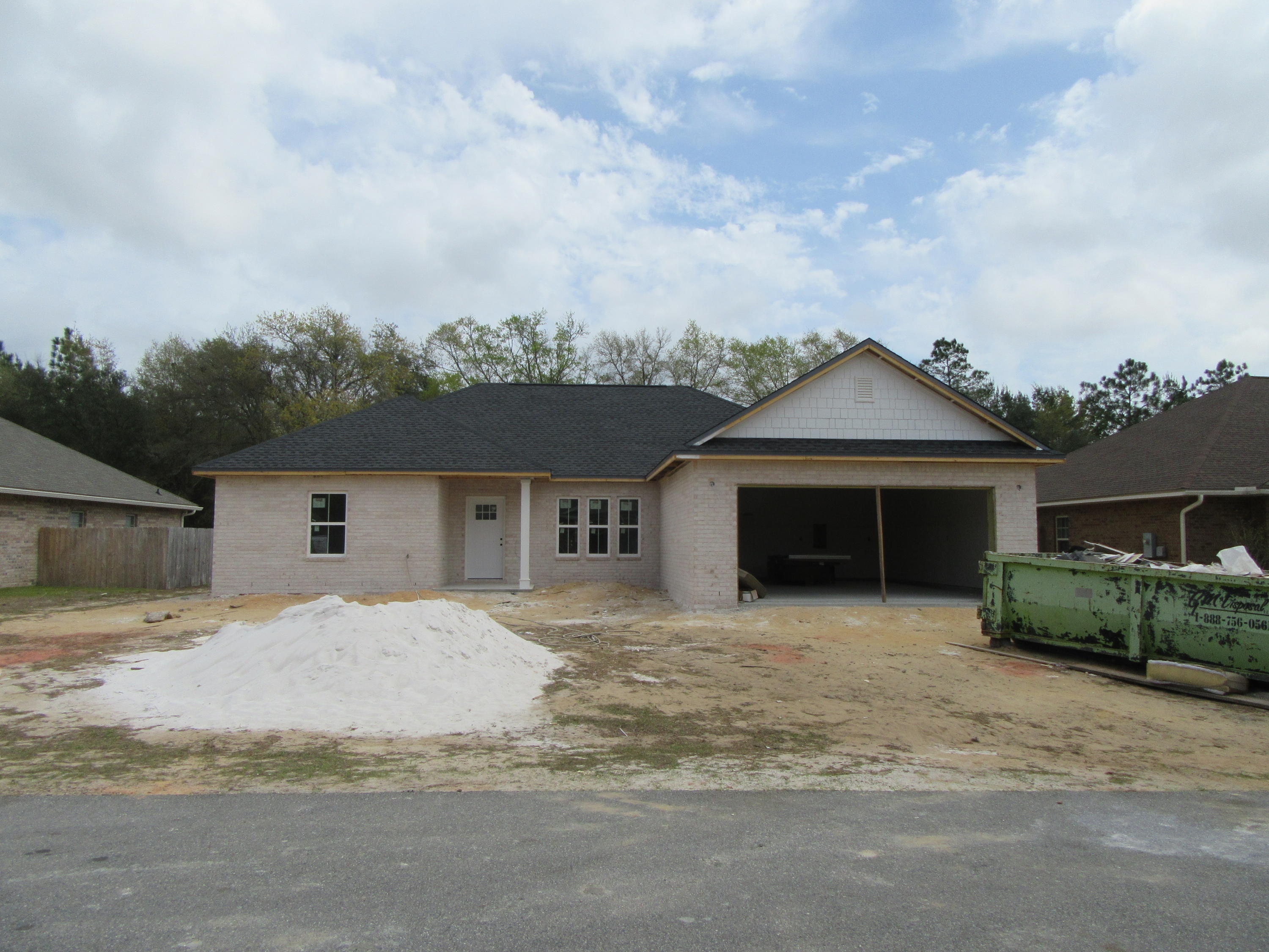 BEAUTIFUL ALL BRICK NEW CUSTOM HOME ON A LARGE LEVEL LOT. THIS IS A VERY OPEN/ SPLIT FLOOR PLAN WITH 4 bd/2ba, covered lanai and two car garage. Enter into the great room with A TREY CEILING W/ crown molding AND recessed lighting in most areas, trey ceiling in foyer, family room and master suite. GREAT ROOM OPENS up to a wonderful kitchen featuring granite counter tops with breakfast bar, stainless appliances to include smooth top range, microwave hood, dishwasher, porcelain tile and 36' upper cabinets with crown molding. The covered PORCH is the perfect place to unwind and watch the sunset! Relax in your master suite offering large walk in closet, two vanities, separate shower, corner garden tub, porcelain tile floor. GRANITE AND CUSTOM CABINETS IN BATHROOM. Fully sodded yard