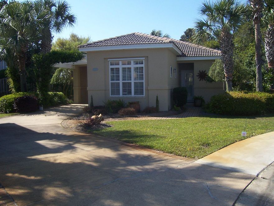 Drastic Price Reduction! Darling 2 bedroom 2 bath home is meticulously maintained and situated on a large lot. It boasts an open floor plan with spacious rooms and large screen porch, that accesses both bedrooms, plantation shutters, security system, an abundance of closet and utility/ storage space, custom hurricane storm panels, covered carport and professional landscaping. The sprinkler system is connected to a chemical tank to prevent the well water from staining the home and fence etc. Perfect as a primary or vacation home. Neighborhood amenities, include a sparkling pool for your summertime enjoyment. Located on the Southside of Hwy 98, Tuscany Subdv. is convenient to beaches, shopping, Destin Commons, Silver Sands Outlet Mall, area attractions and nightlife. Buyer to verify squa